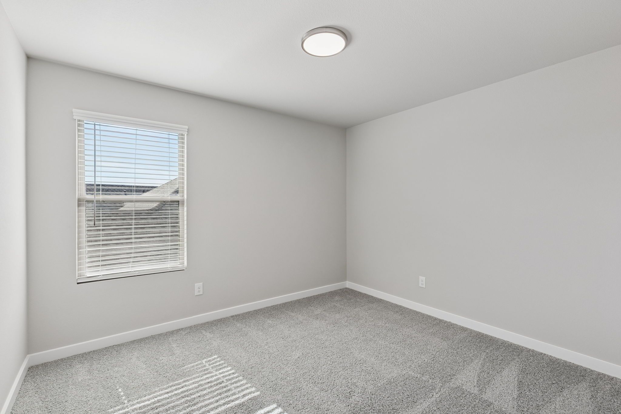 Bedroom in the Holden home plan by Trophy Signature Homes – REPRESENTATIVE PHOTO