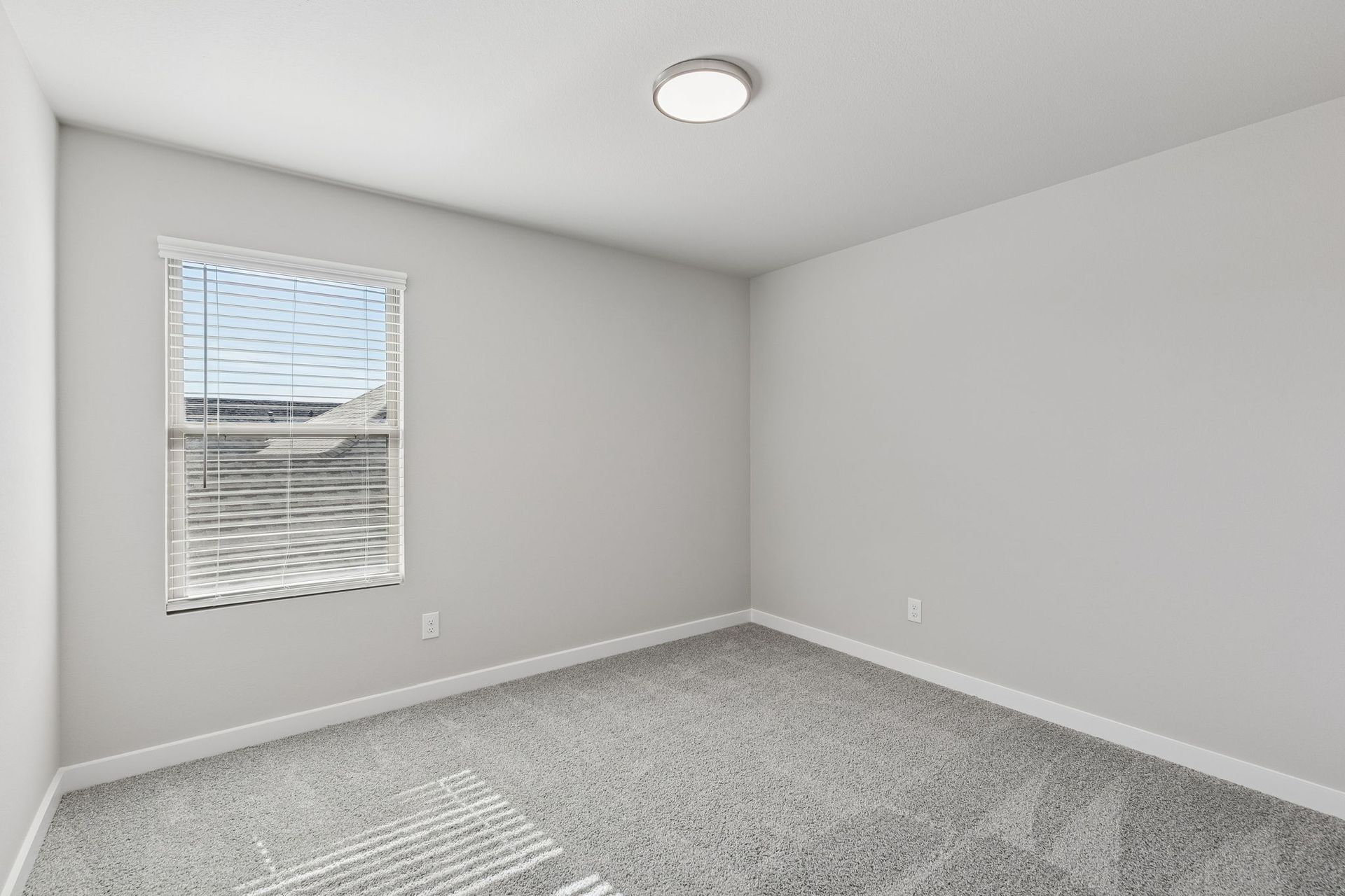 Bedroom in the Holden home plan by Trophy Signature Homes – REPRESENTATIVE PHOTO