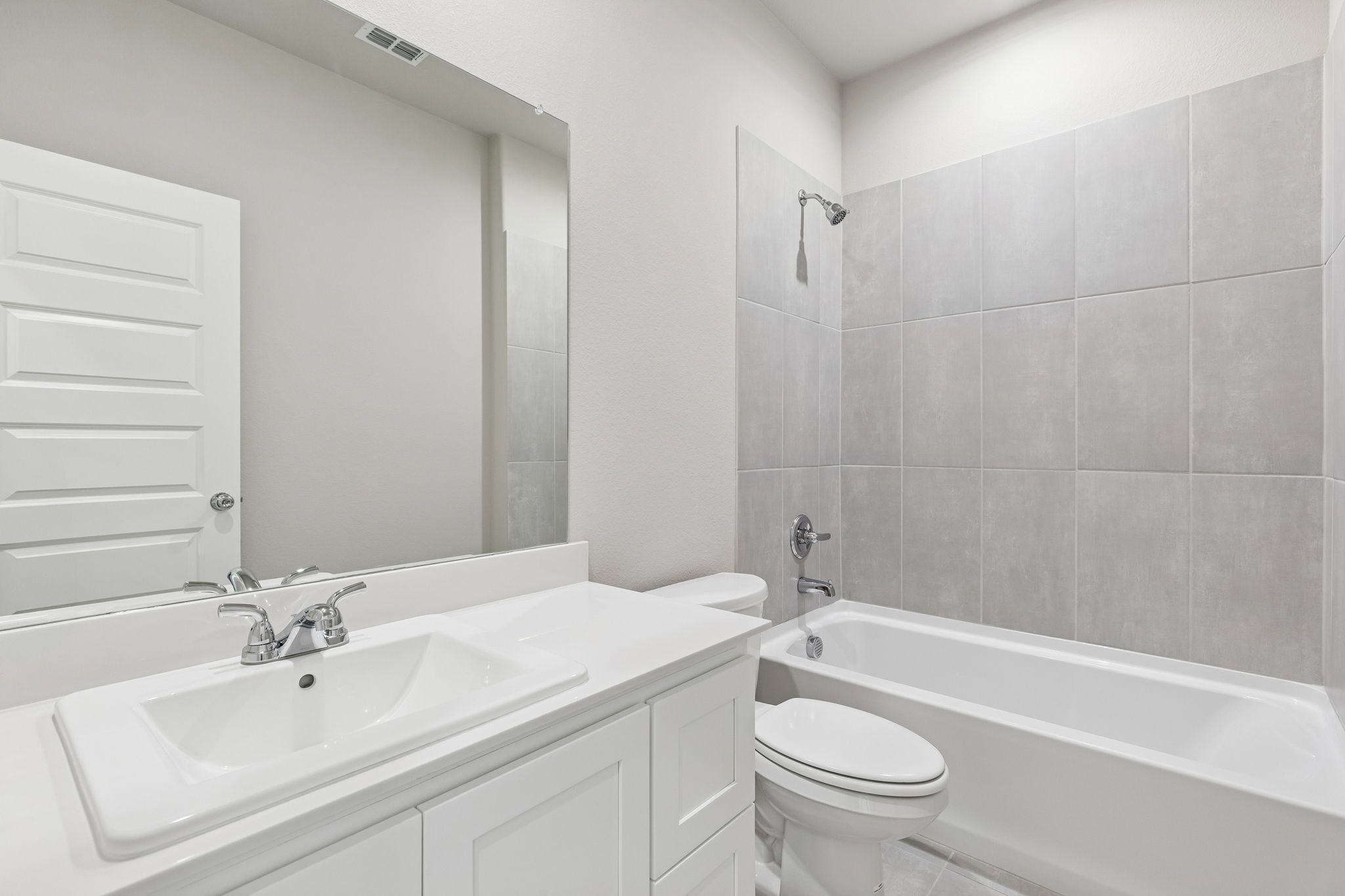 Bathroom in the Holden home plan by Trophy Signature Homes – REPRESENTATIVE PHOTO