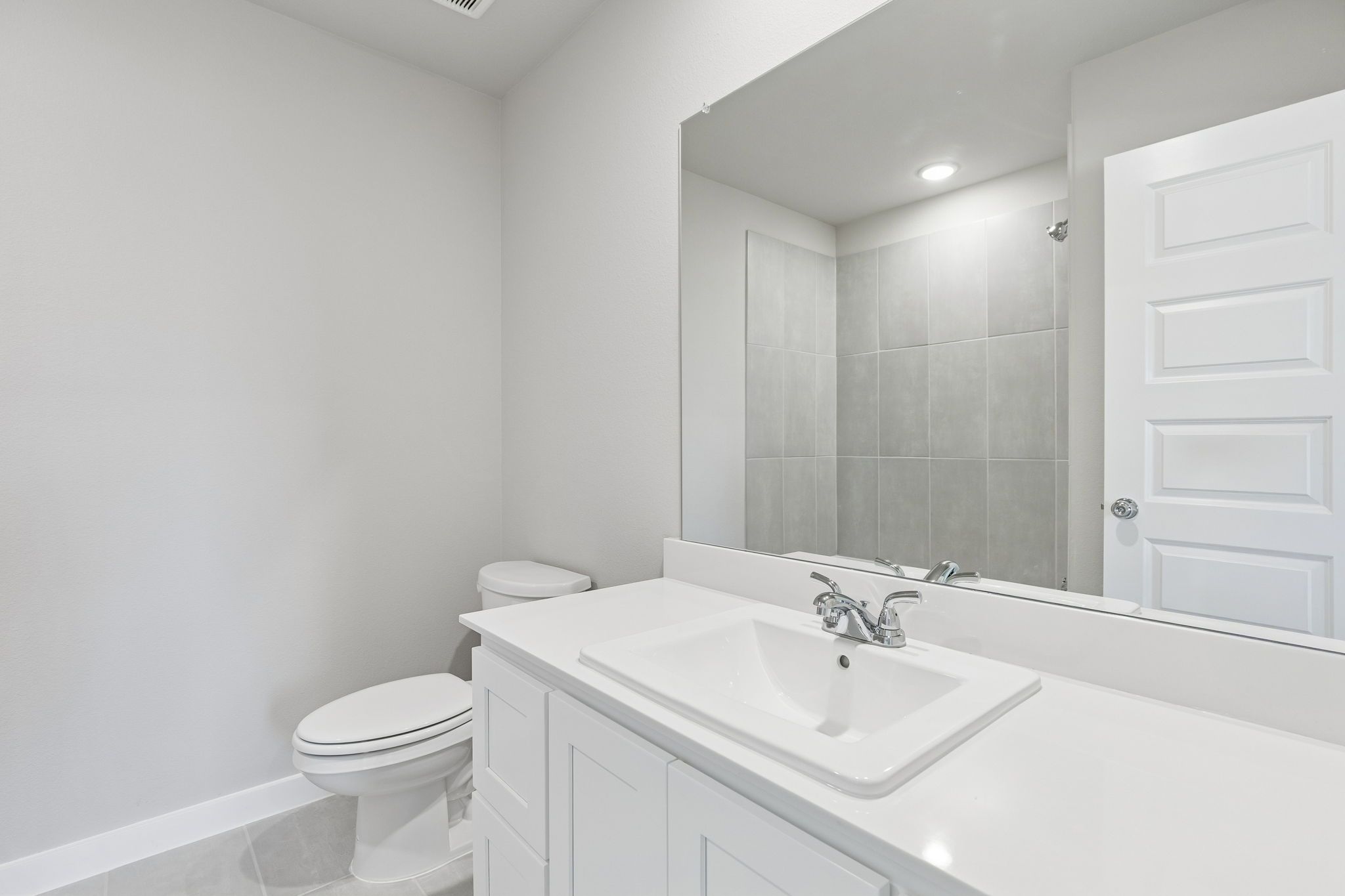 Bathroom in the Holden home plan by Trophy Signature Homes – REPRESENTATIVE PHOTO