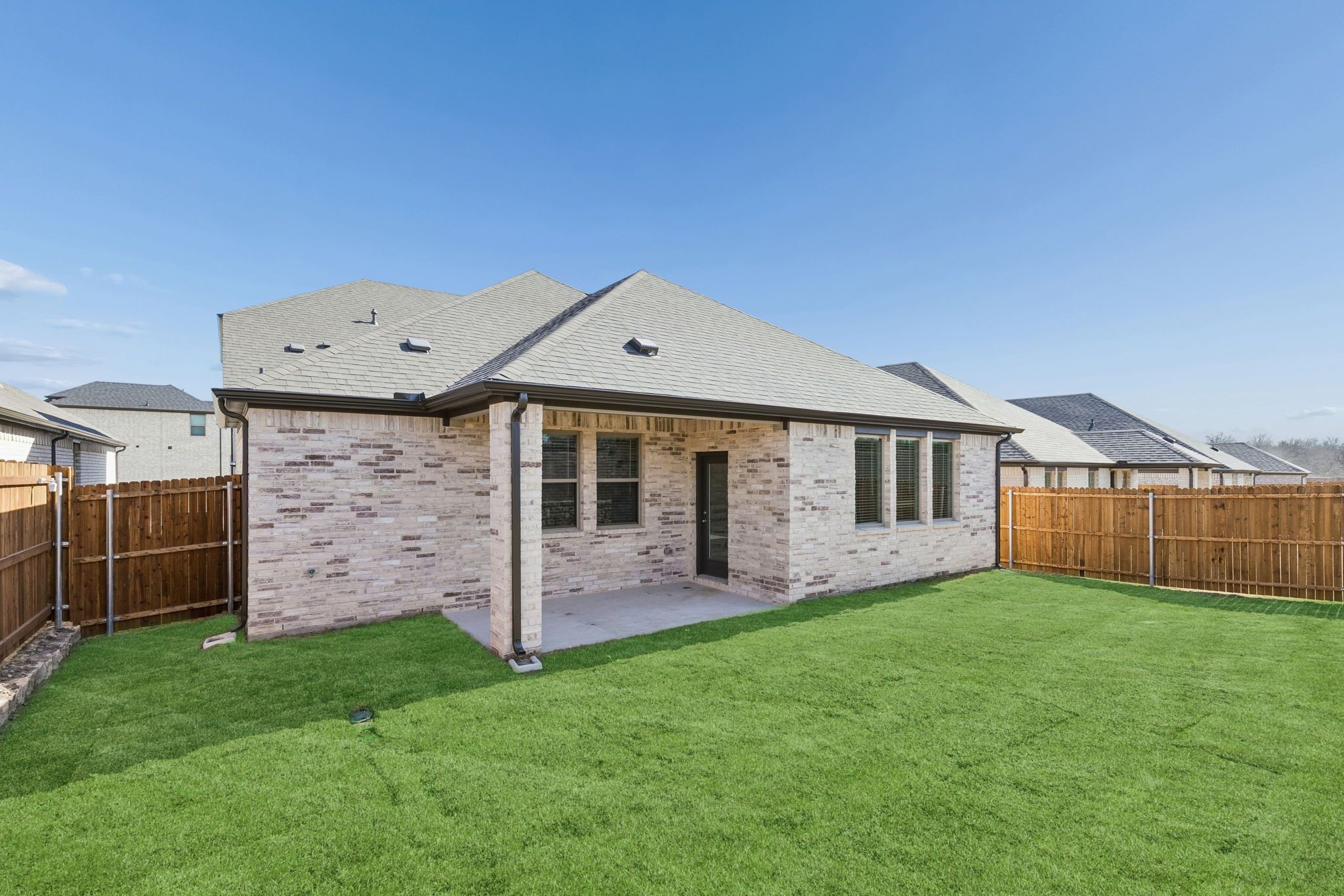 Patio in the Holden home plan by Trophy Signature Homes – REPRESENTATIVE PHOTO