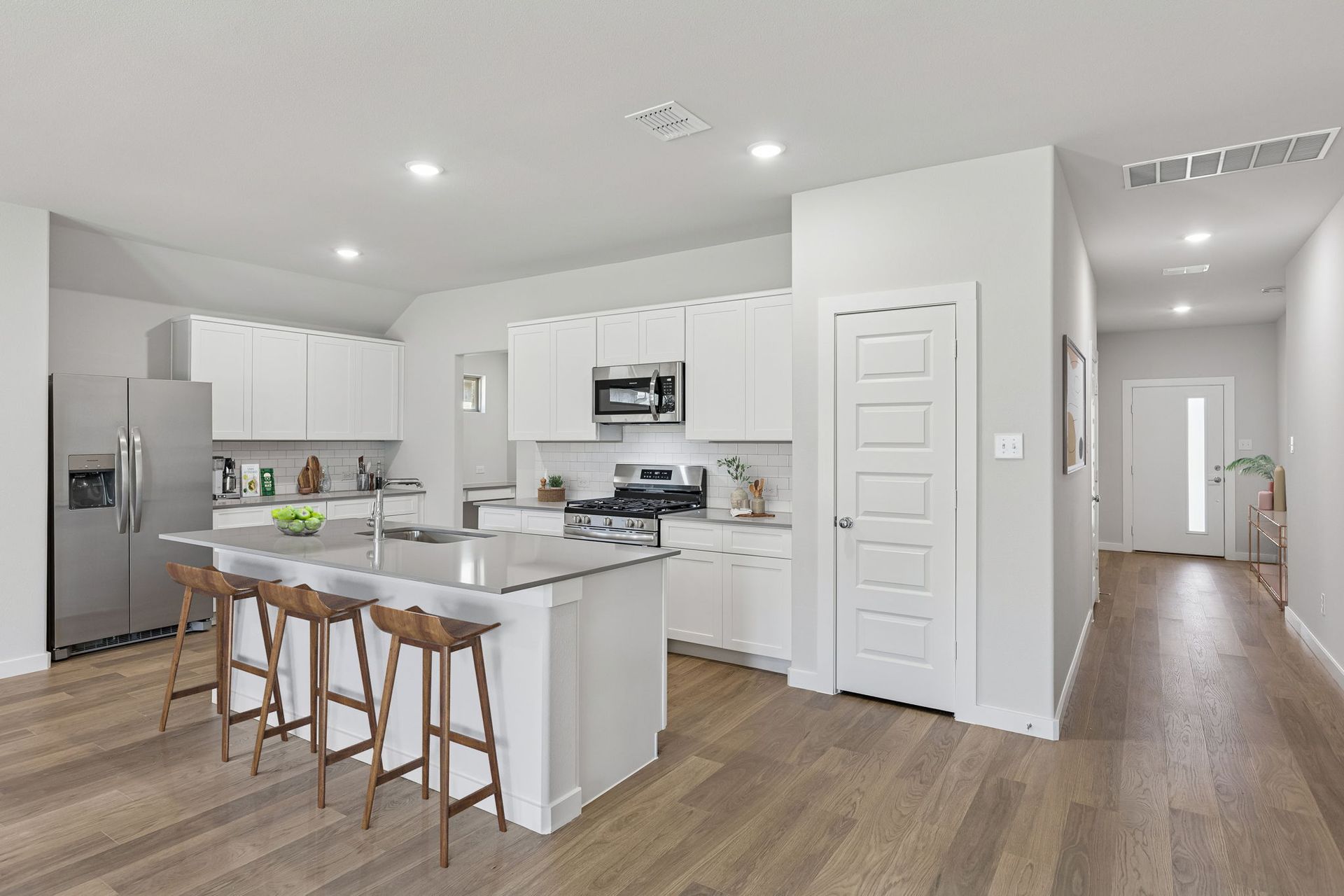 Kitchen in the Harrison home plan by Trophy Signature Homes – REPRESENTATIVE PHOTO