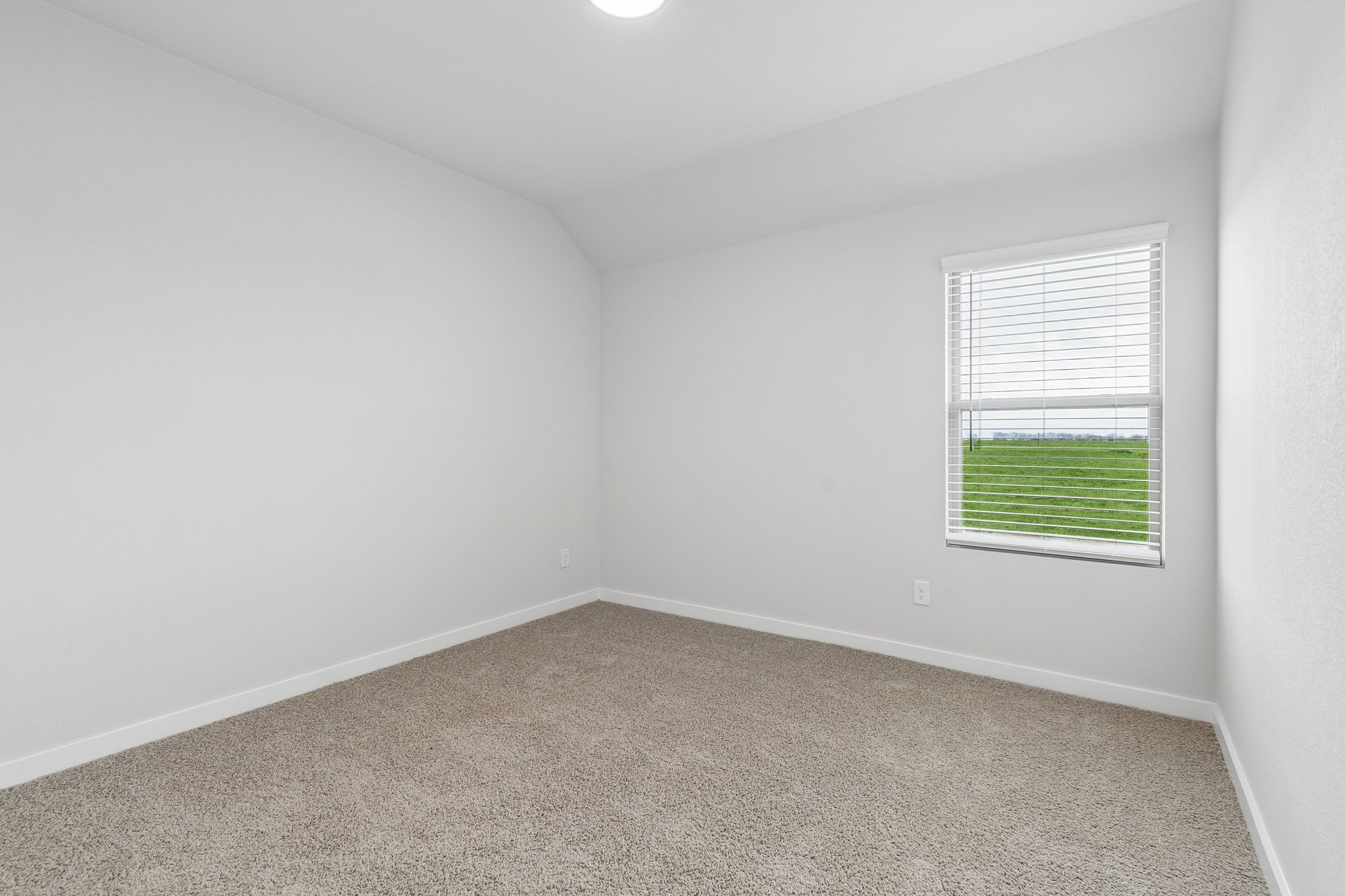 Bedroom in the Oscar home plan by Trophy Signature Homes – REPRESENTATIVE PHOTO