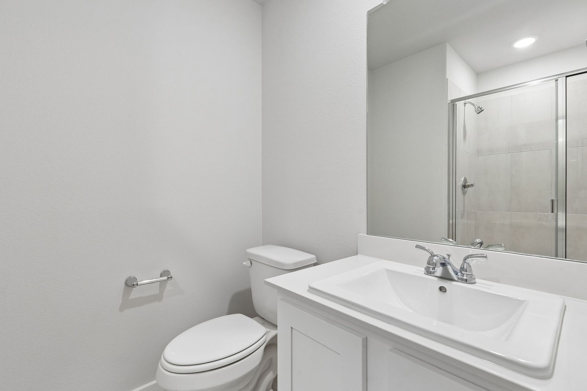 Bathroom in the Oscar home plan by Trophy Signature Homes – REPRESENTATIVE PHOTO