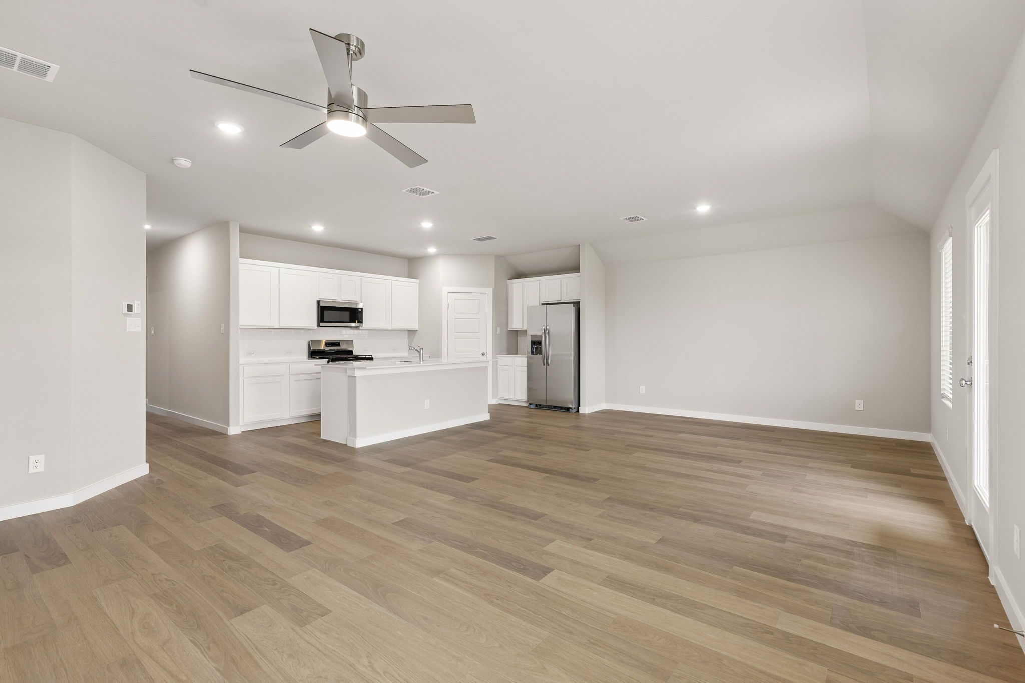 Open Floor Plan in the Emmy II home plan by Trophy Signature Homes - REPRESENTATIVE PHOTO