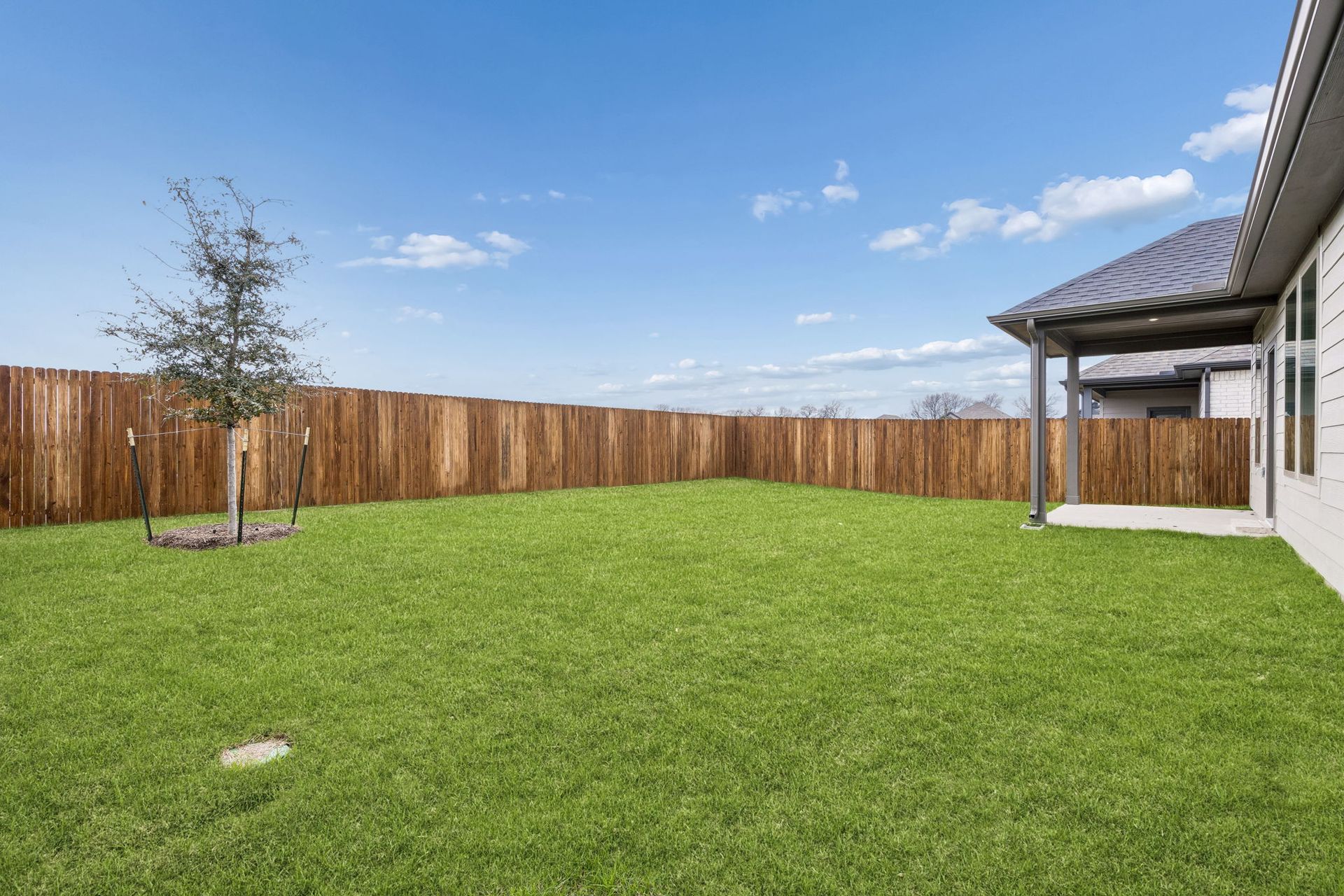 Covered Patio in the Winters home plan by Trophy Signature Homes – REPRESENTATIVE PHOTO