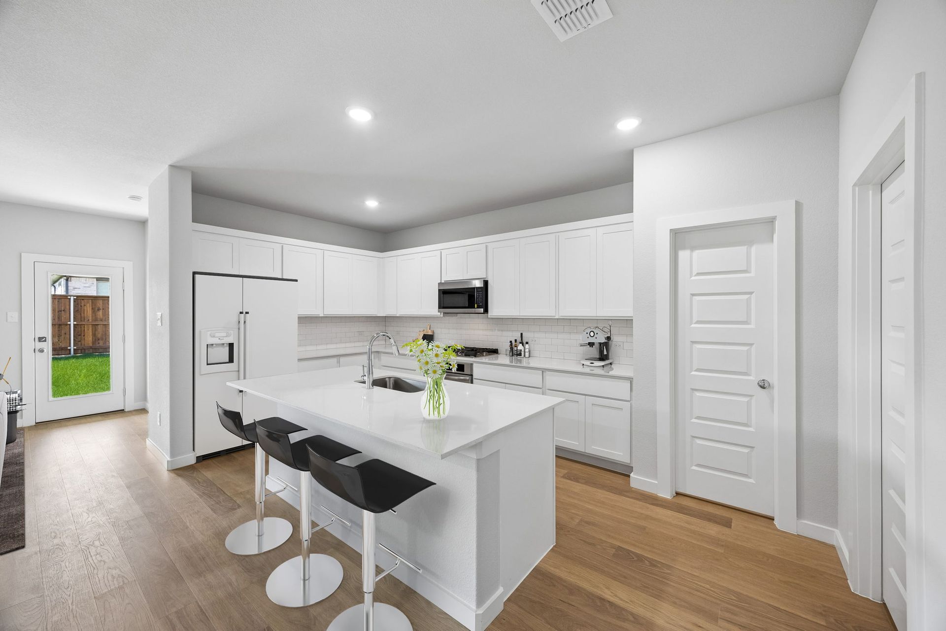 Kitchen in the Oscar home plan by Trophy Signature Homes – REPRESENTATIVE PHOTO