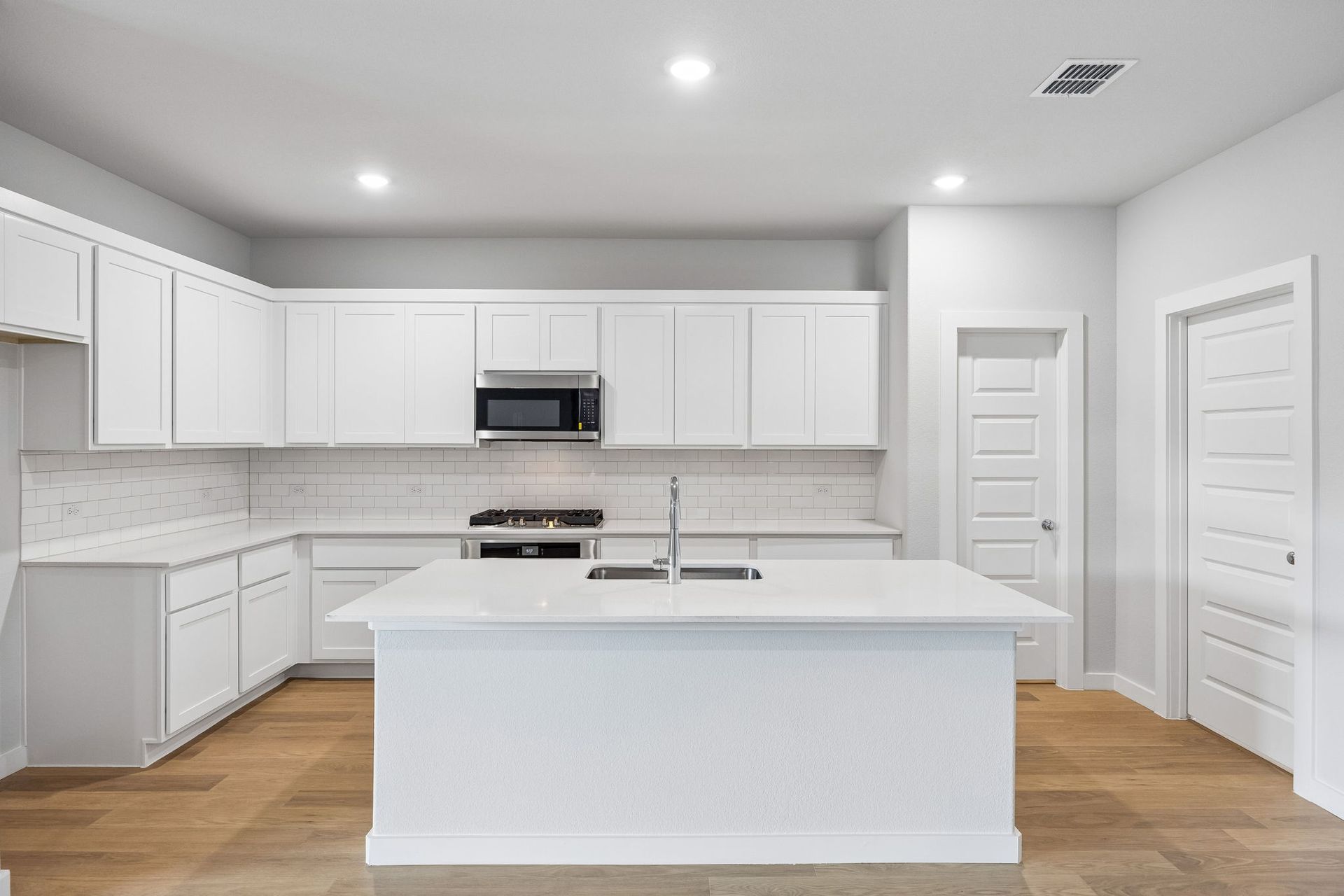 Kitchen in the Oscar home plan by Trophy Signature Homes – REPRESENTATIVE PHOTO