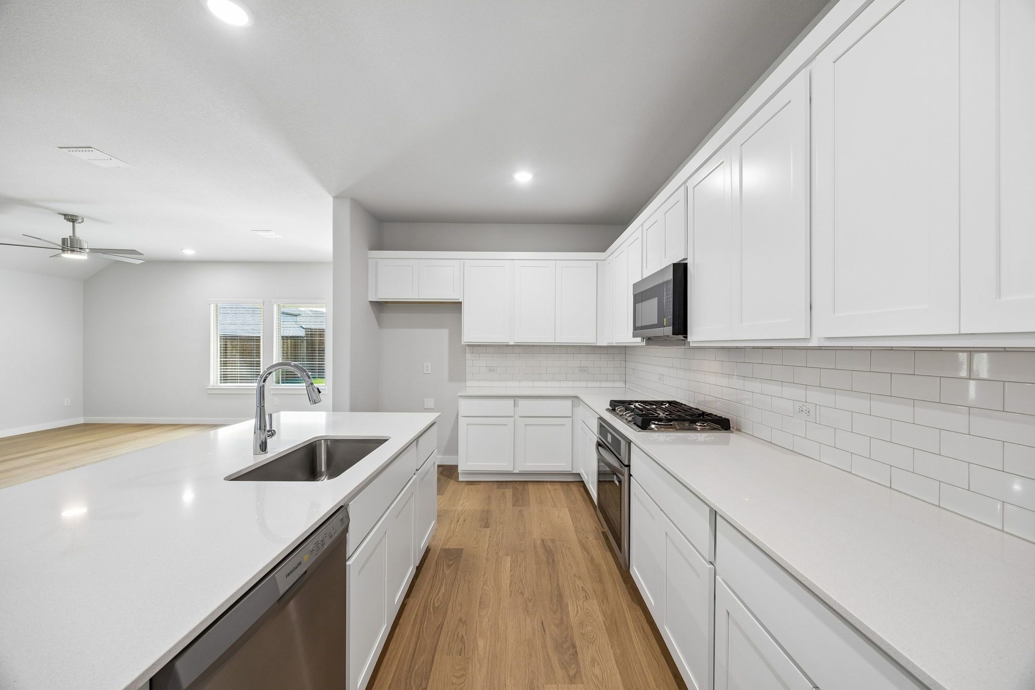 Kitchen in the Oscar home plan by Trophy Signature Homes – REPRESENTATIVE PHOTO
