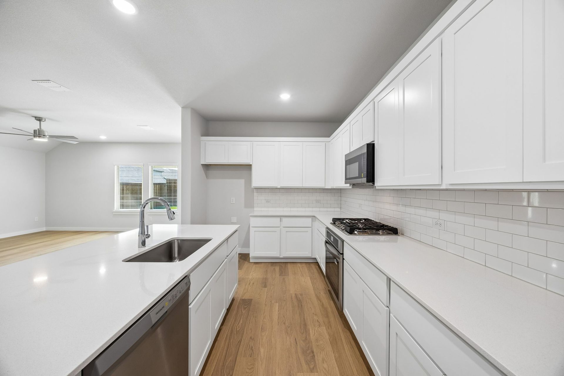 Kitchen in the Oscar home plan by Trophy Signature Homes – REPRESENTATIVE PHOTO