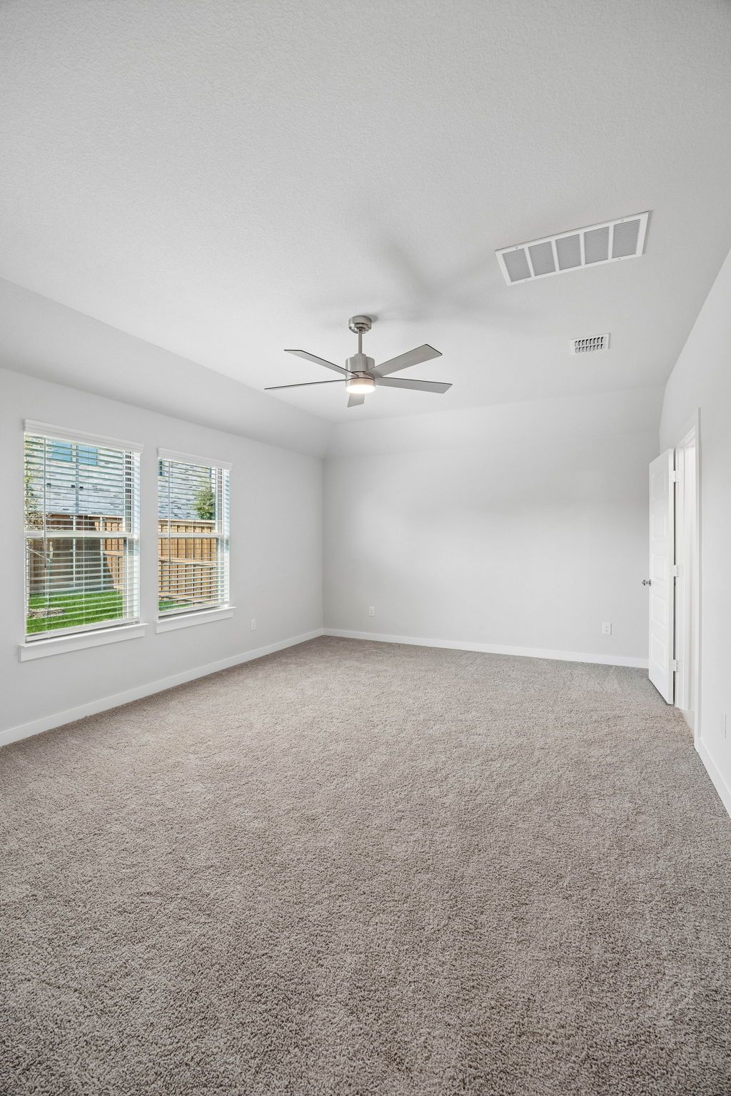 Primary Suite in the Oscar home plan by Trophy Signature Homes – REPRESENTATIVE PHOTO