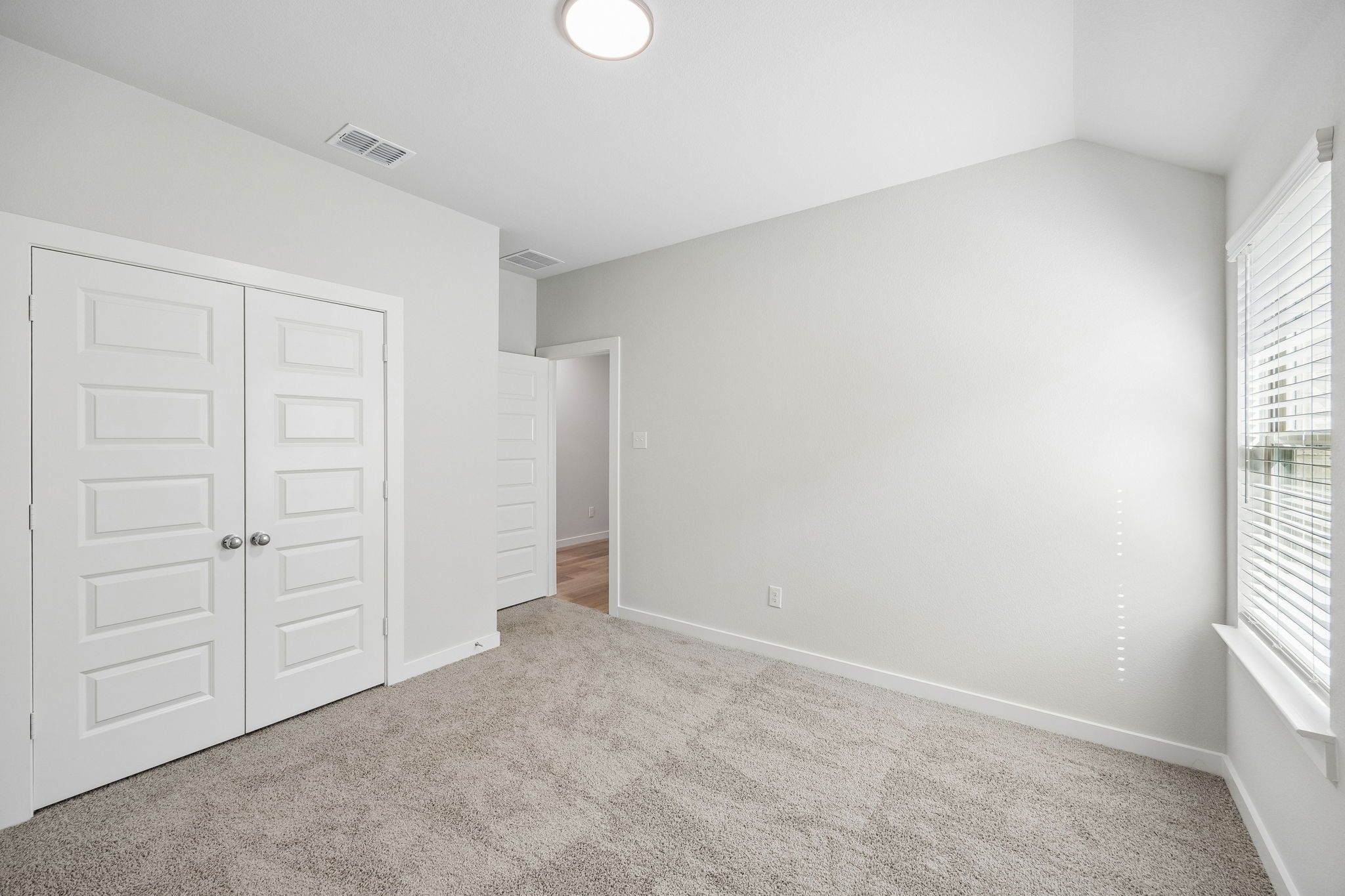 Bedroom in the Oscar home plan by Trophy Signature Homes – REPRESENTATIVE PHOTO
