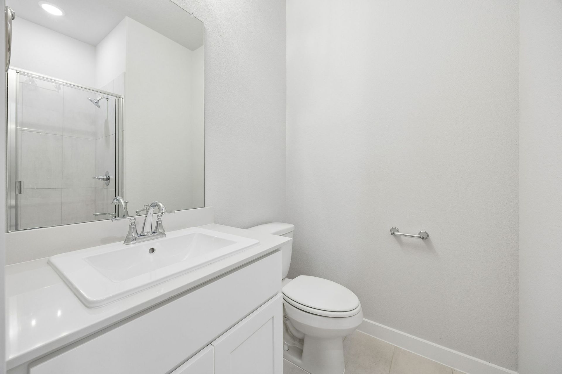 Bathroom in the Oscar home plan by Trophy Signature Homes – REPRESENTATIVE PHOTO