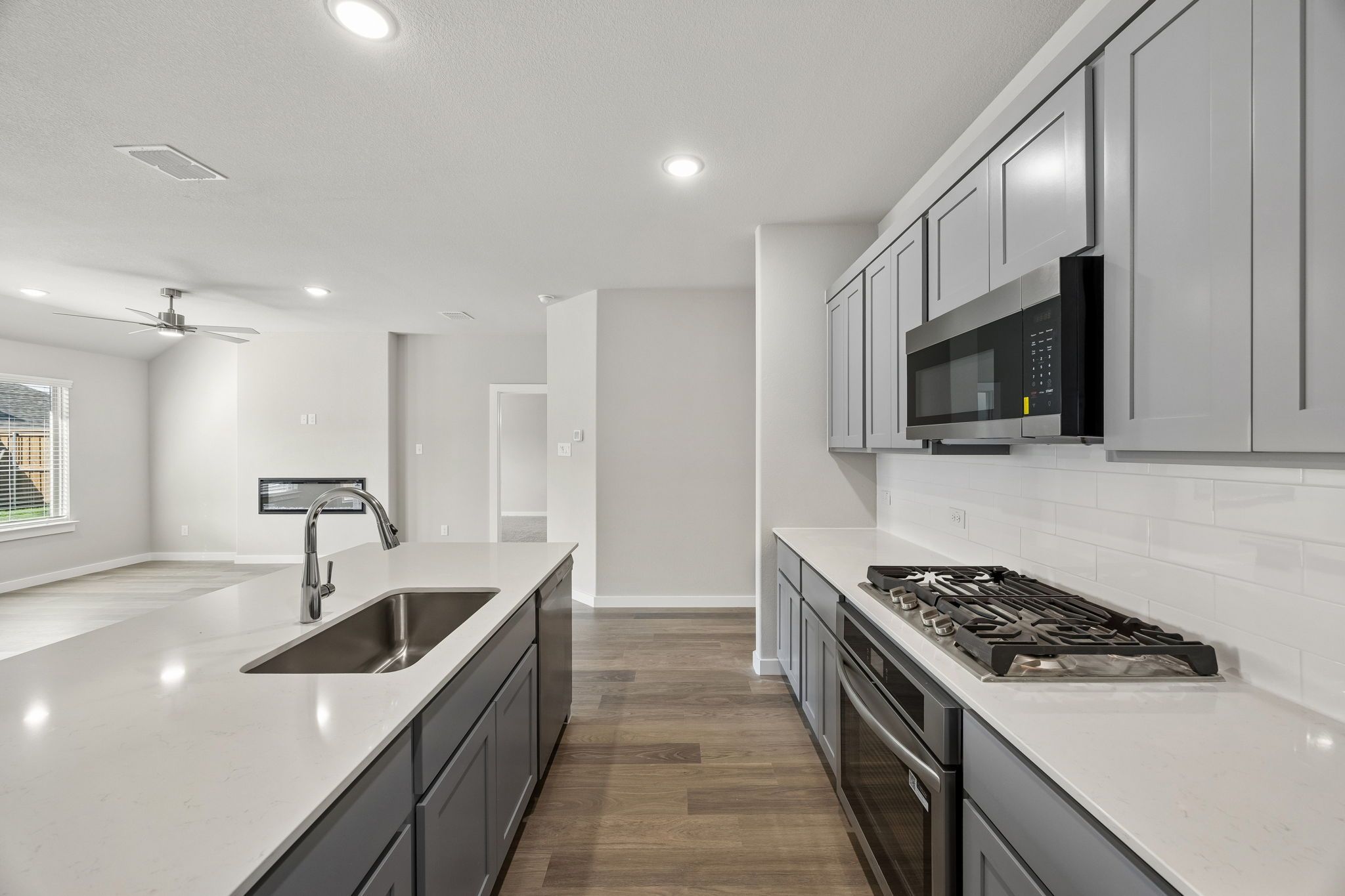 Kitchen in the Emmy II home plan by Trophy Signature Homes - REPRESENTATIVE PHOTO