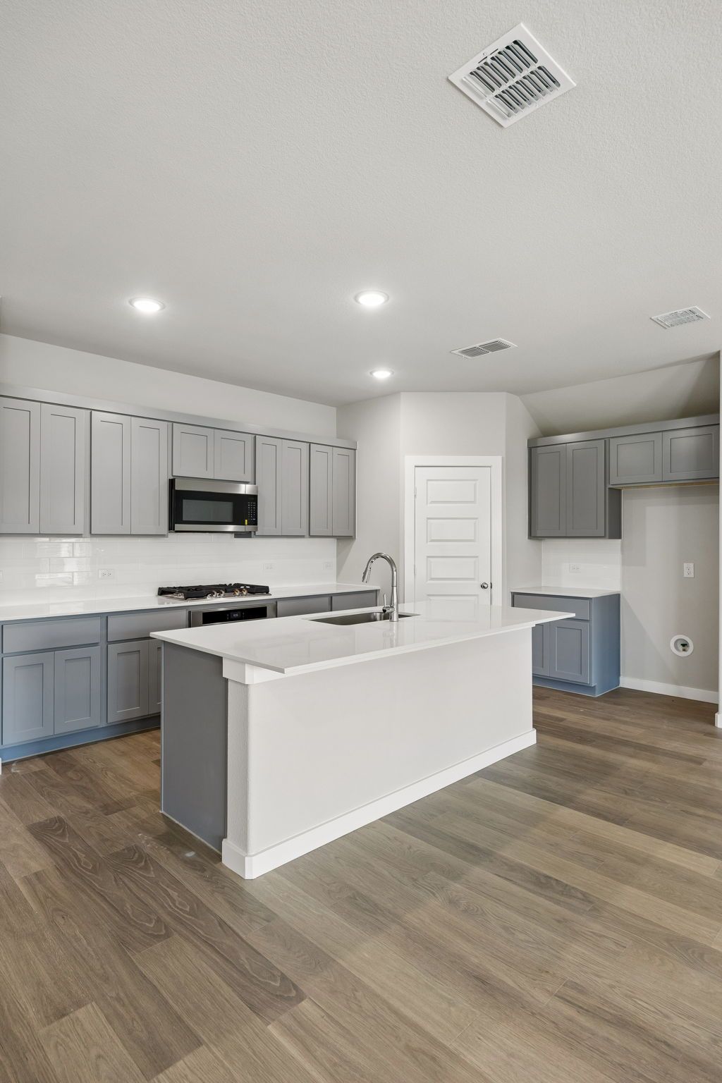 Kitchen in the Emmy II home plan by Trophy Signature Homes - REPRESENTATIVE PHOTO
