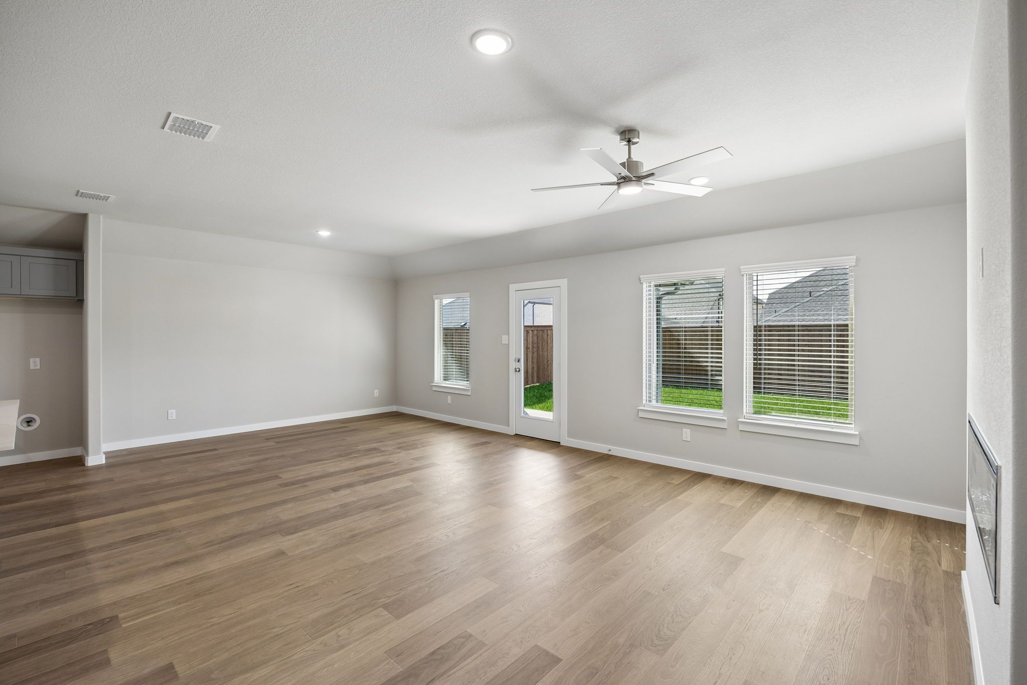 Living and Dining in the Emmy II home plan by Trophy Signature Homes - REPRESENTATIVE PHOTO