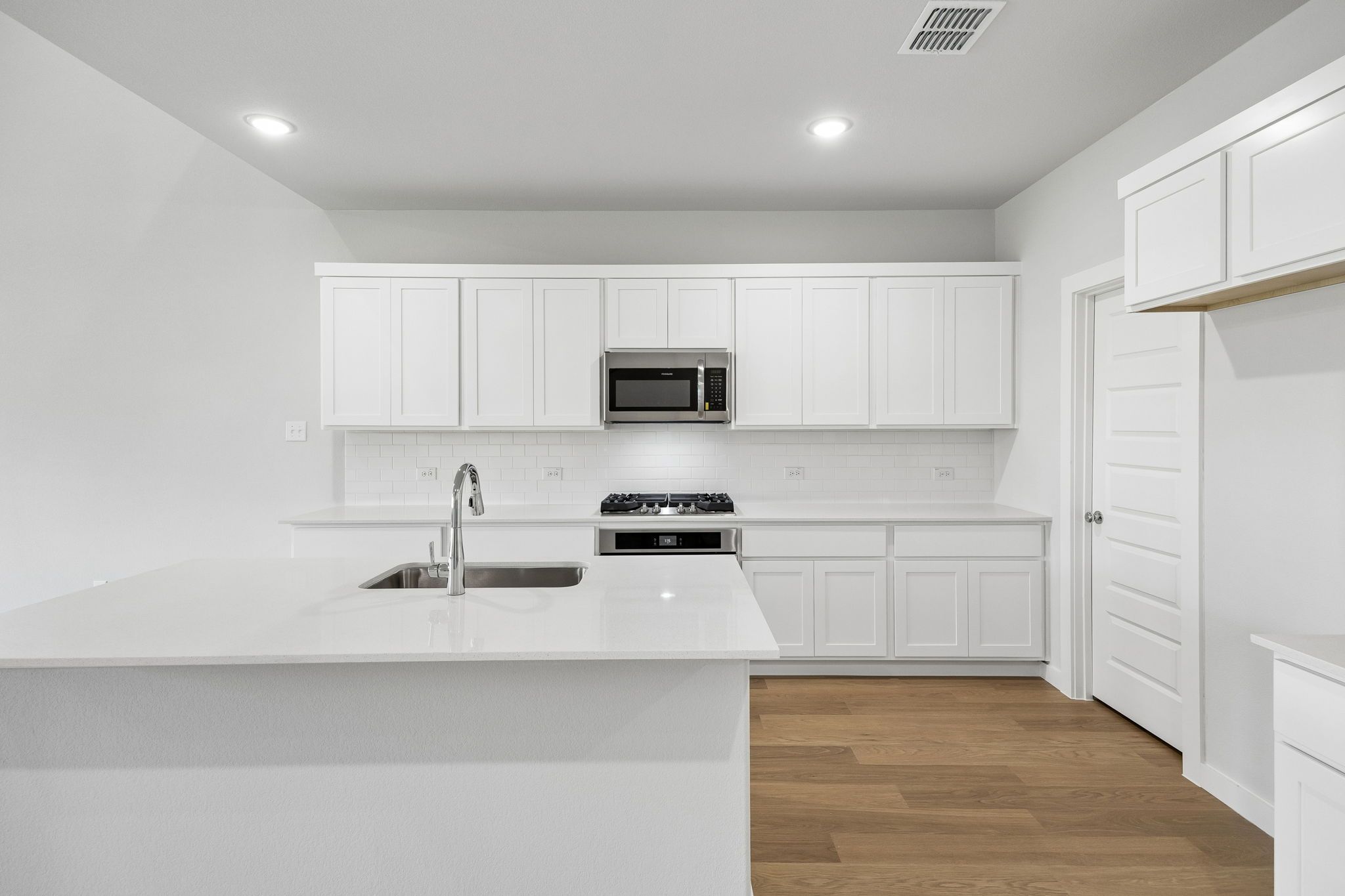 Kitchen in the Winters home plan by Trophy Signature Homes – REPRESENTATIVE PHOTO