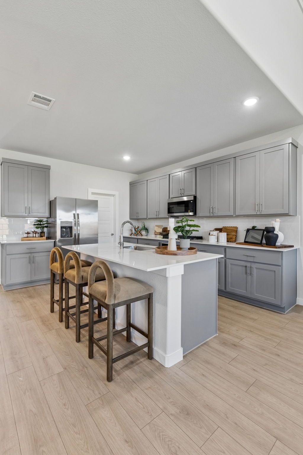 Kitchen in the Winters model home in Gunter TX by Trophy Signature Homes