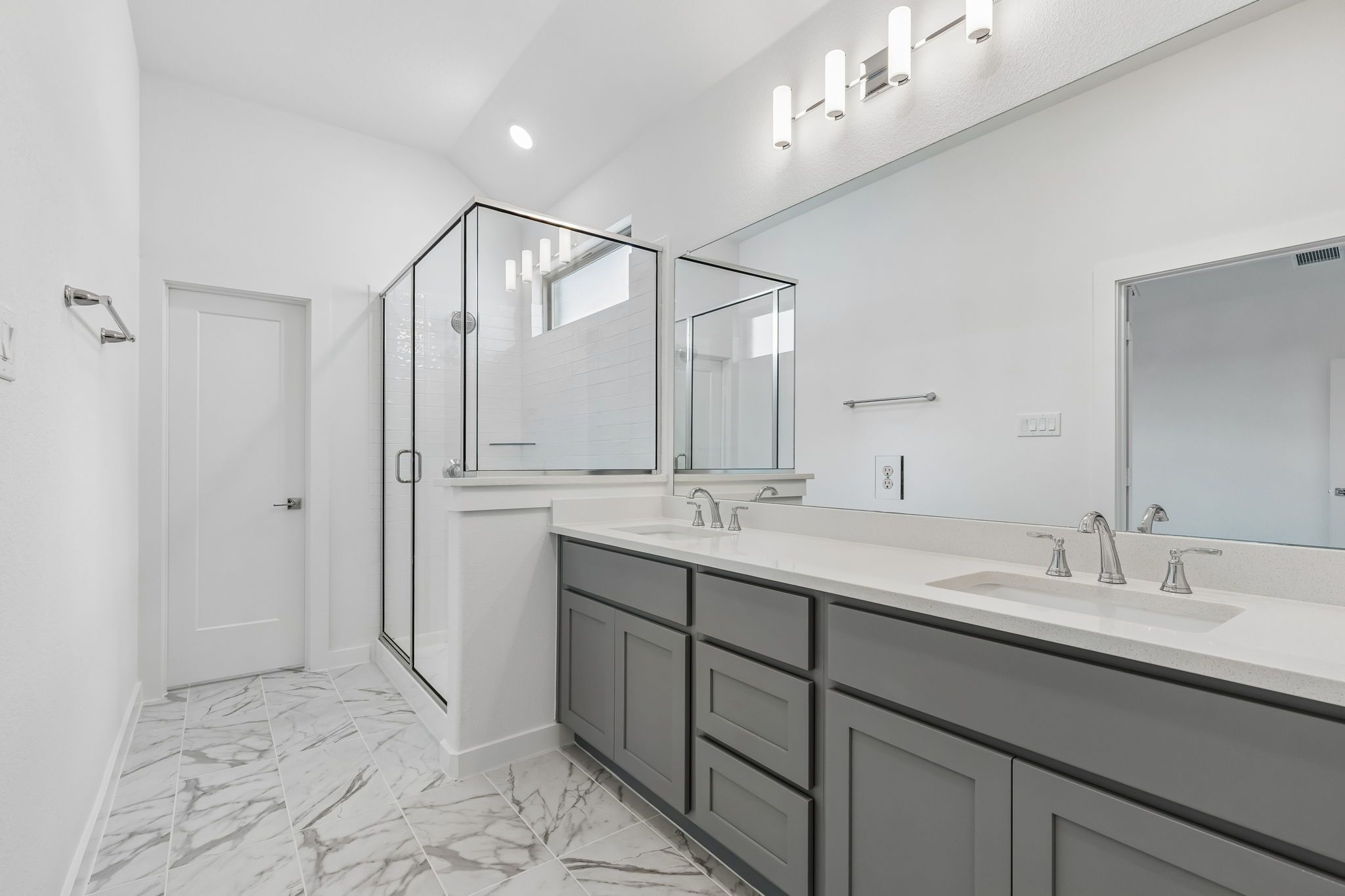 Primary Bathroom in the Claret home plan by Trophy Signature Homes – REPRESENTATIVE PHOTO