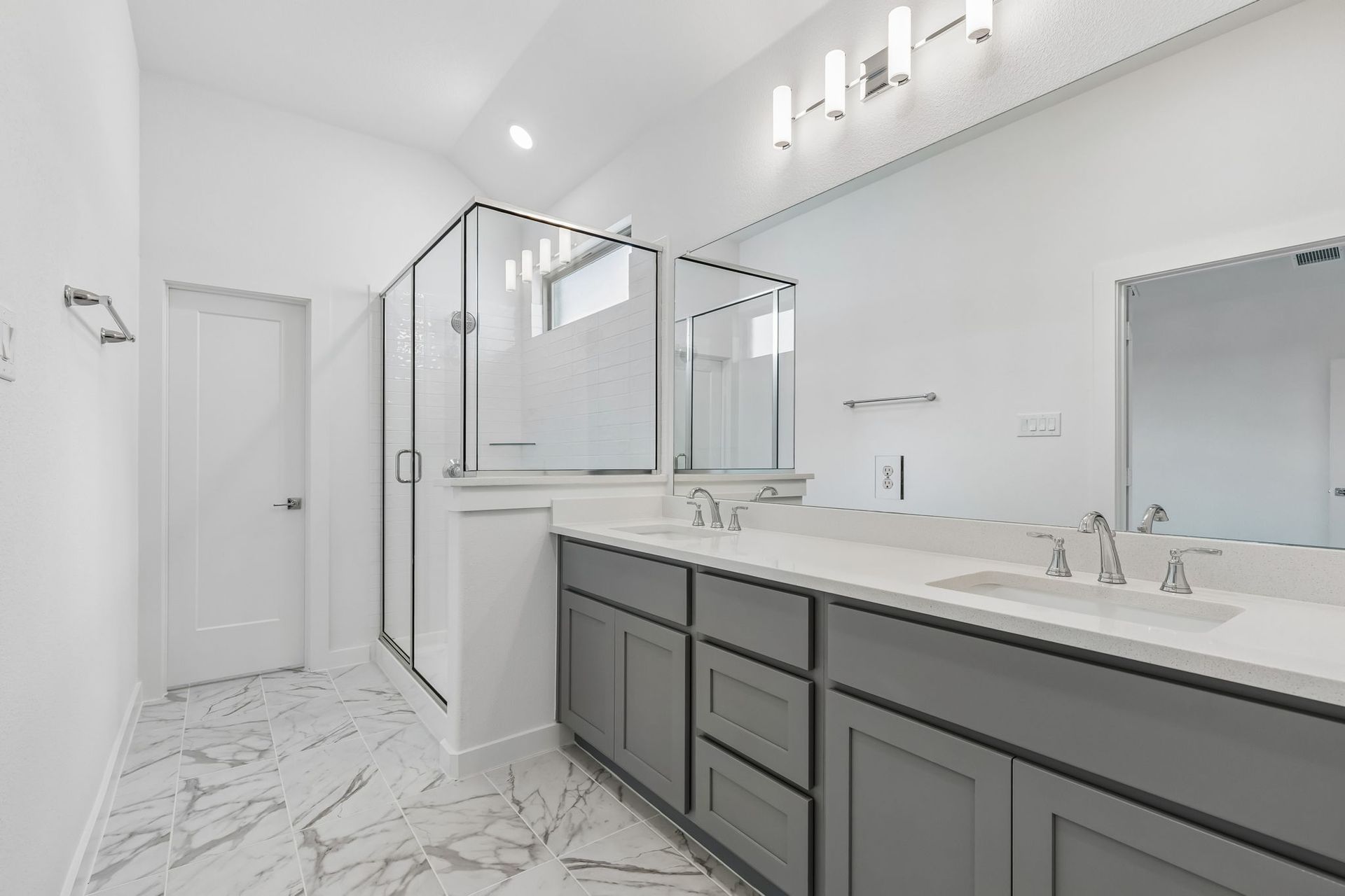 Primary Bathroom in the Claret home plan by Trophy Signature Homes – REPRESENTATIVE PHOTO