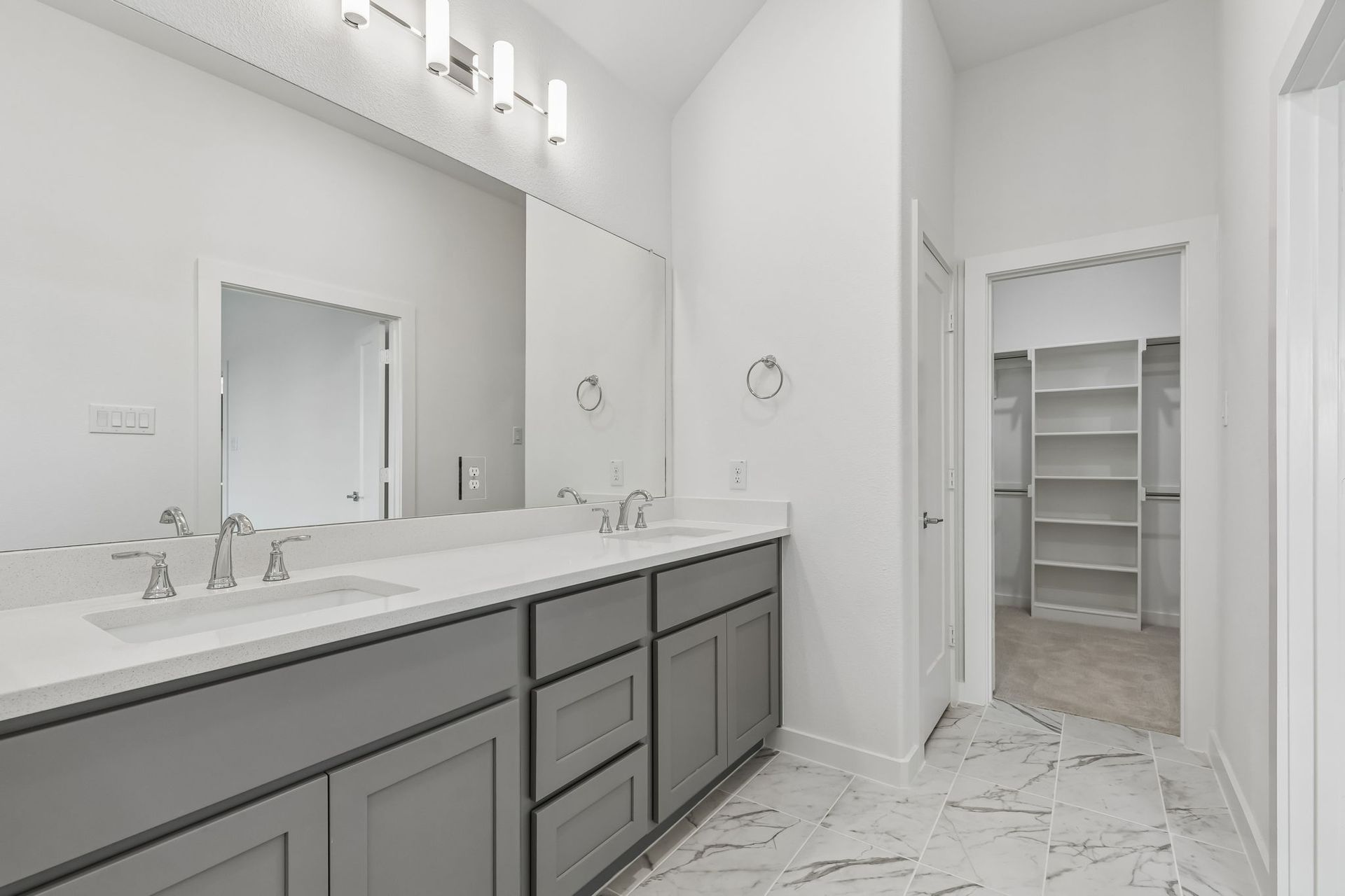 Primary Bathroom in the Claret home plan by Trophy Signature Homes – REPRESENTATIVE PHOTO