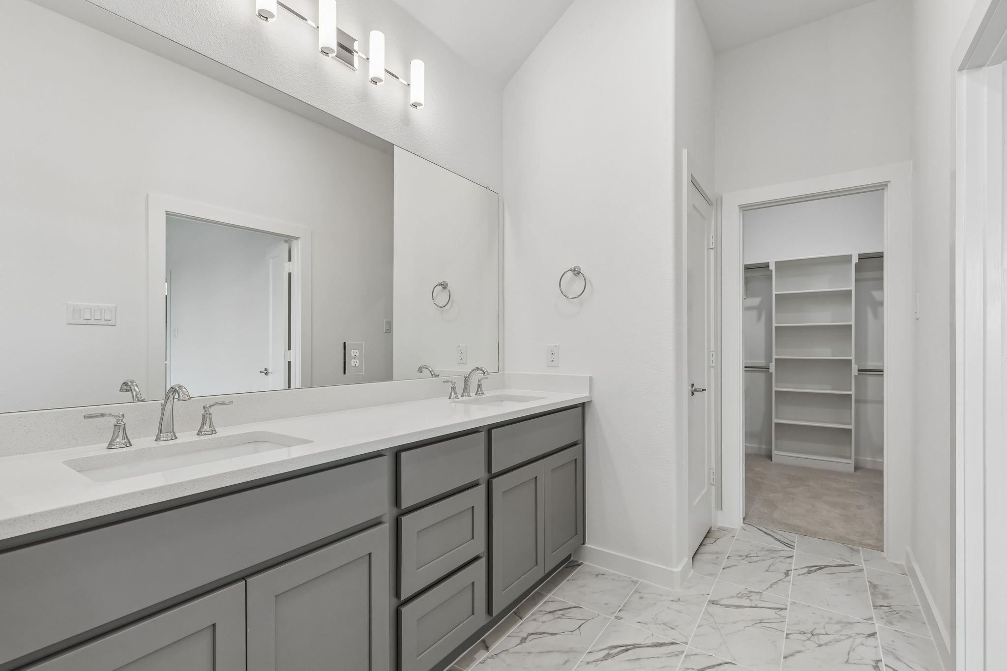 Primary Bathroom in the Claret home plan by Trophy Signature Homes – REPRESENTATIVE PHOTO