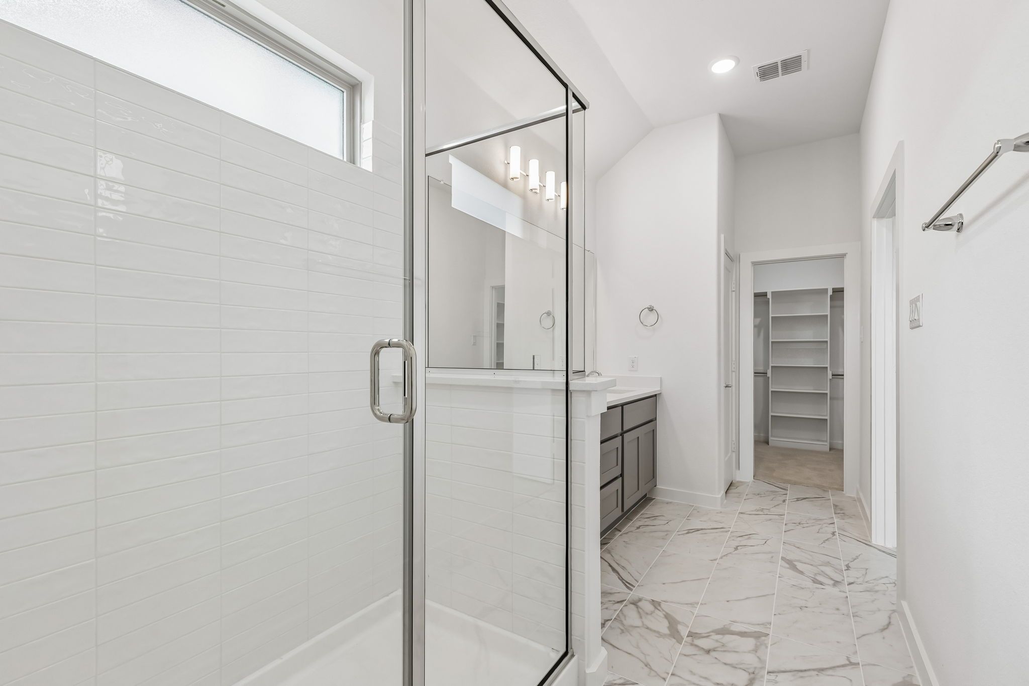 Primary Bathroom in the Claret home plan by Trophy Signature Homes – REPRESENTATIVE PHOTO