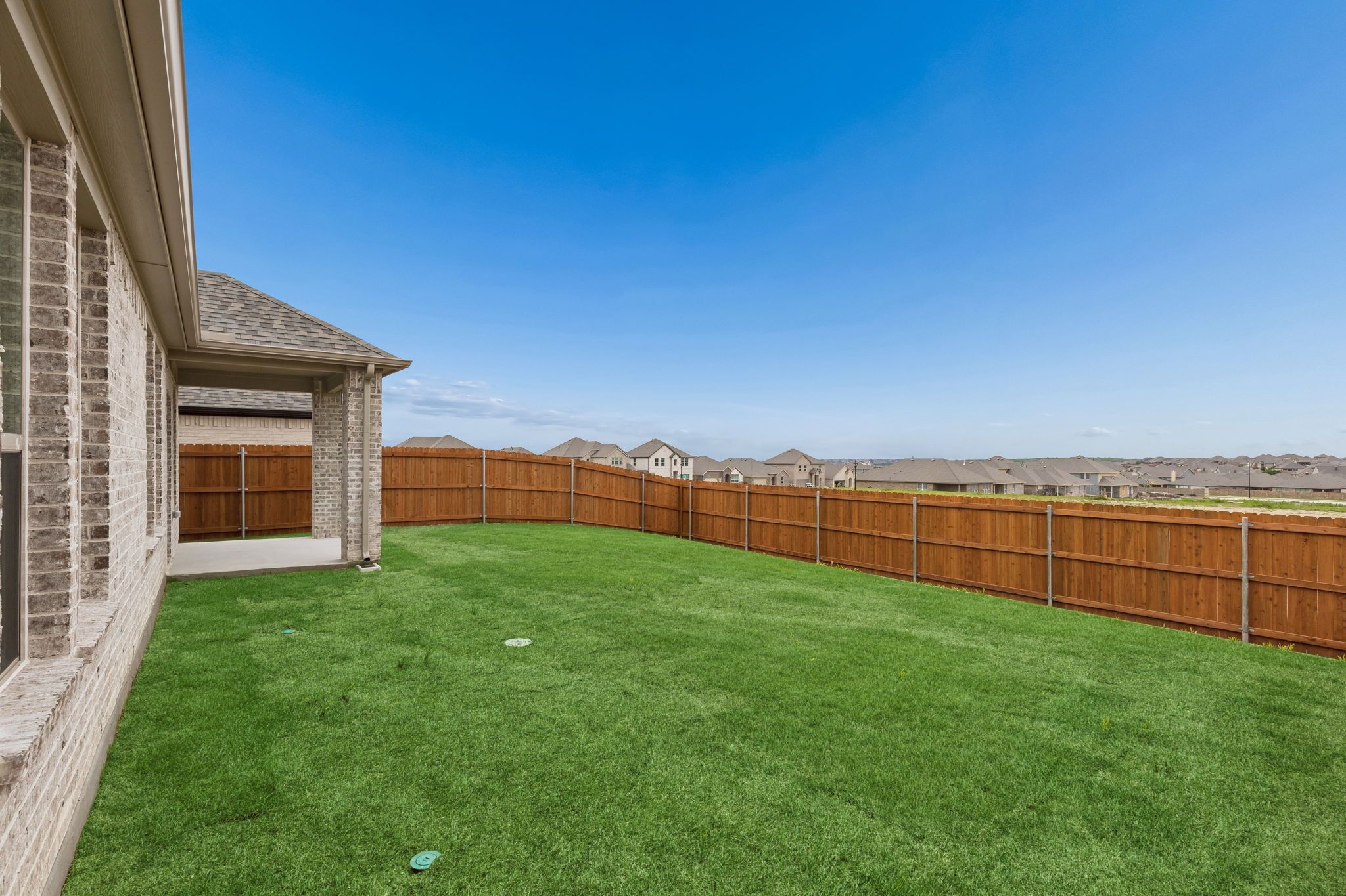 Covered Patio in the Winters home plan by Trophy Signature Homes – REPRESENTATIVE PHOTO
