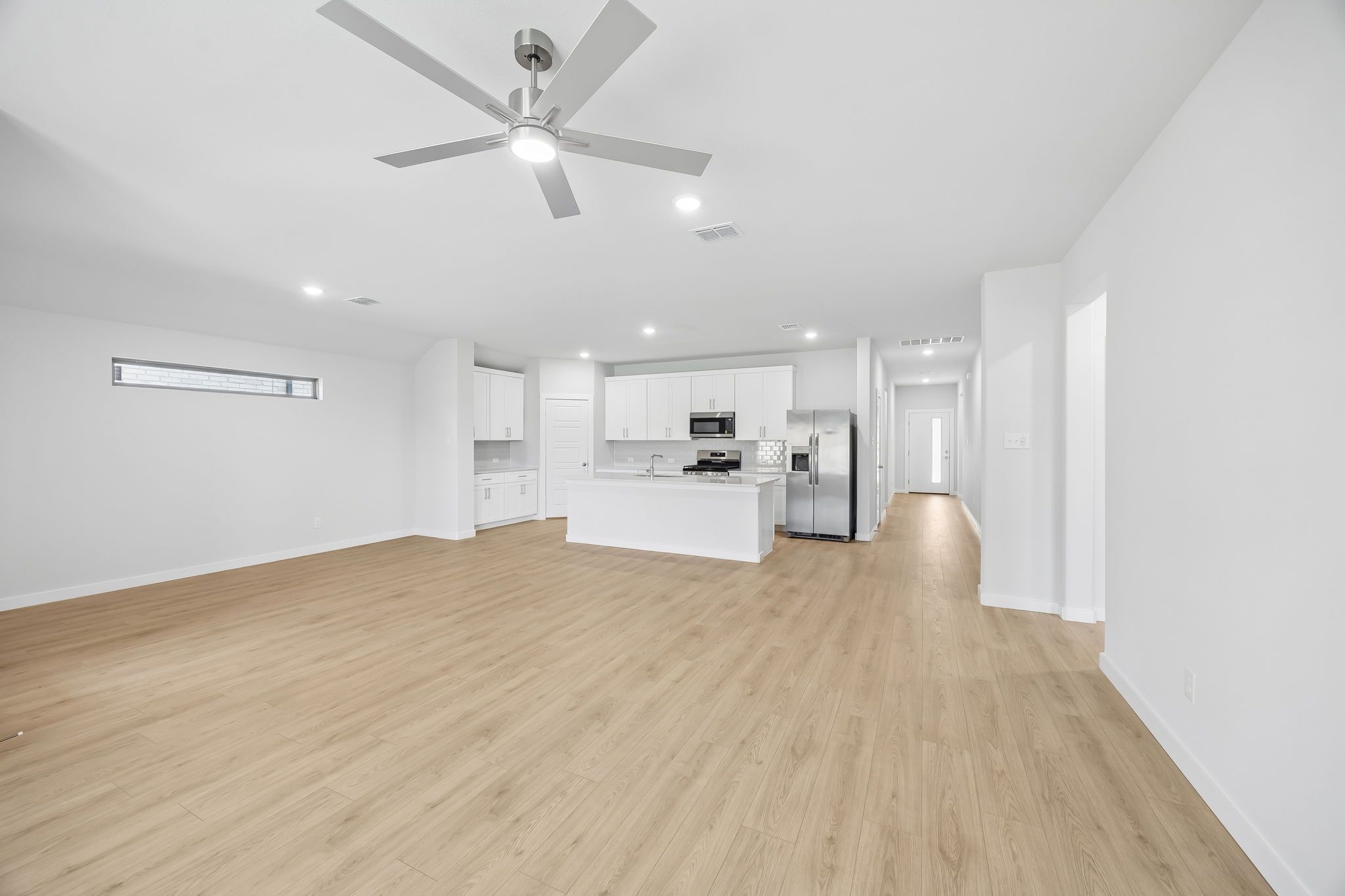 Open concept in the Heisman home plan by Trophy Signature Homes – REPRESENTATIVE PHOTO