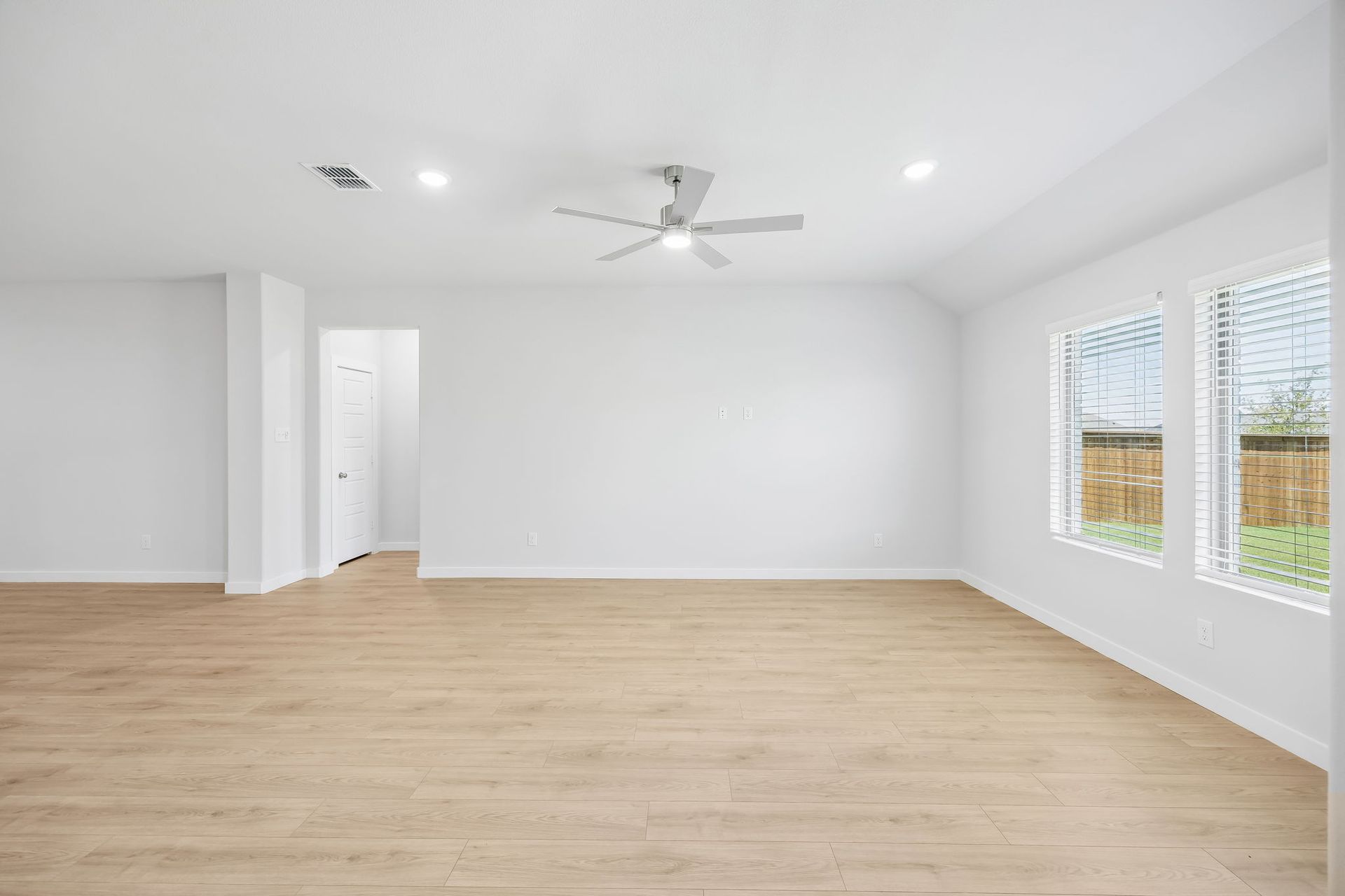 Living room in the Heisman home plan by Trophy Signature Homes – REPRESENTATIVE PHOTO