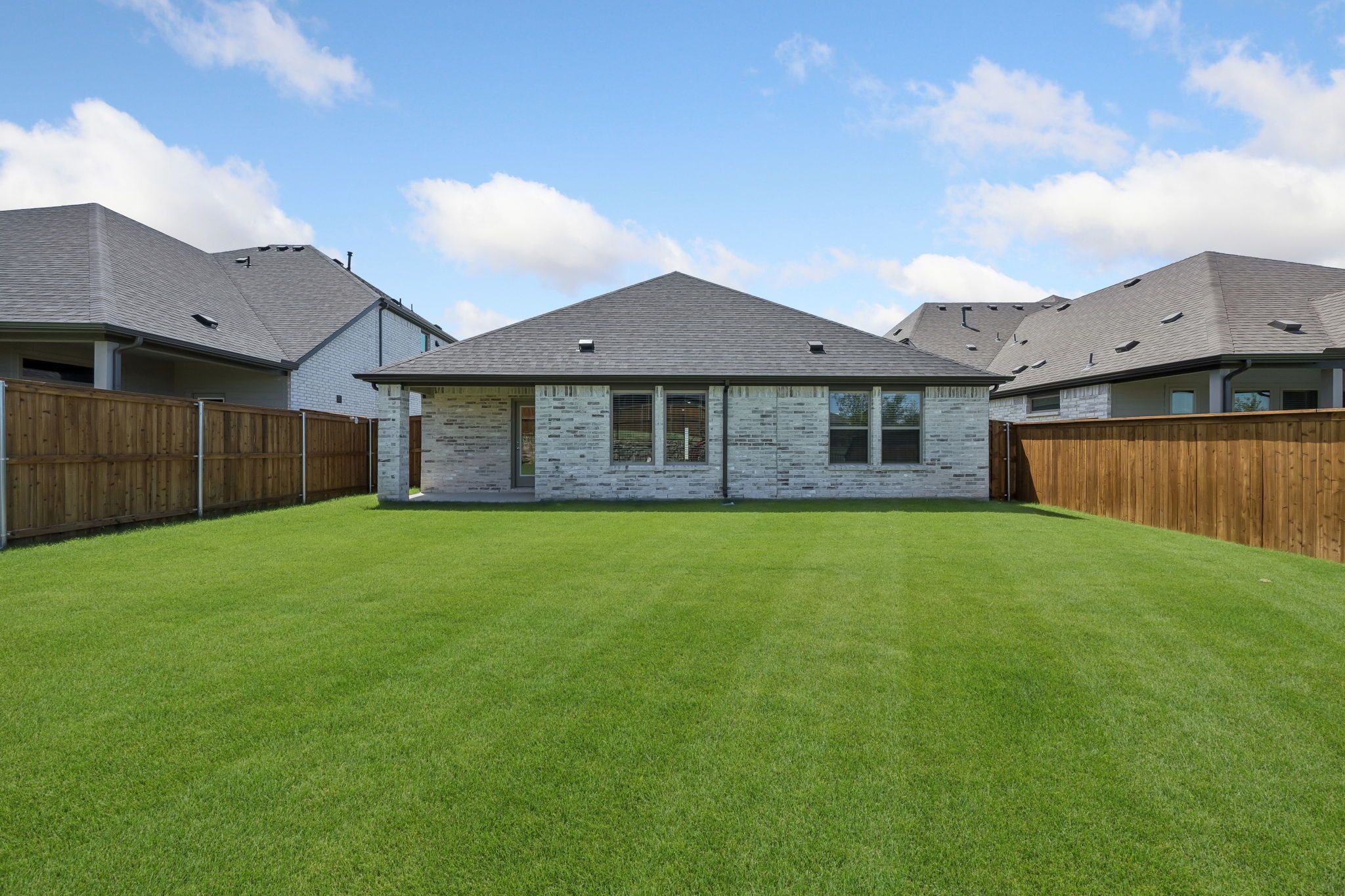 Covered patio in the Heisman home plan by Trophy Signature Homes – REPRESENTATIVE PHOTO