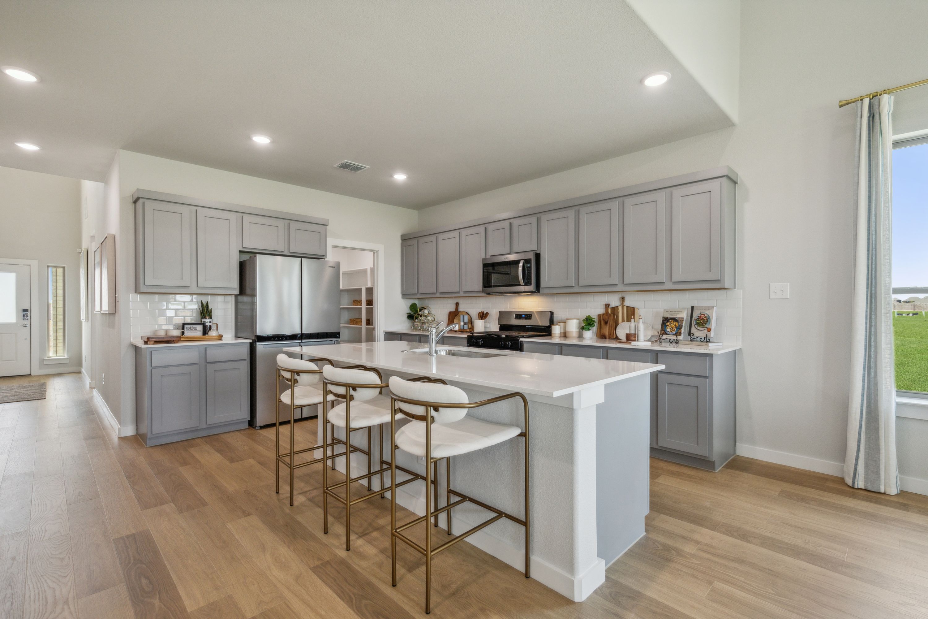 Kitchen in a Windmore new Winters Model in Princeton TX by Trophy Signature Homes