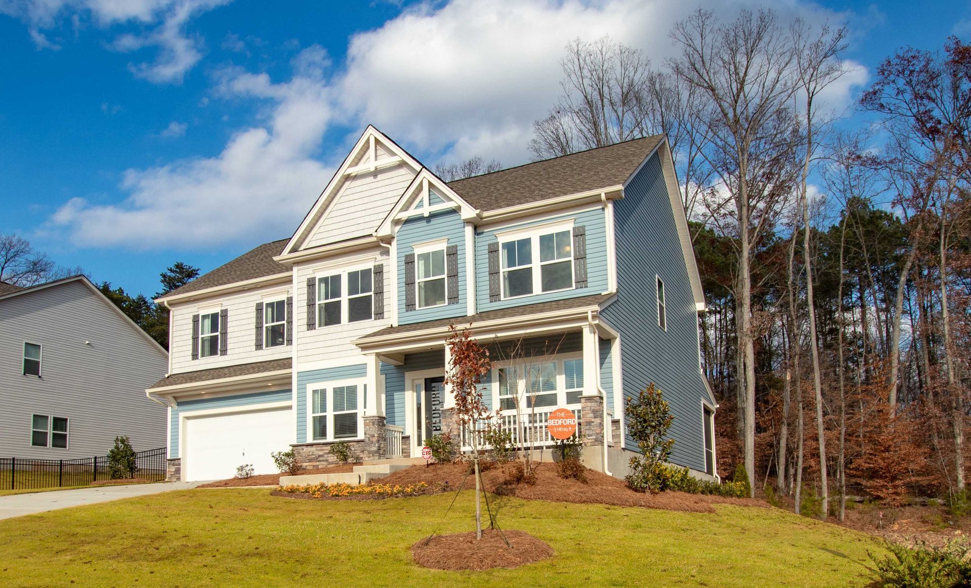 a blue and white house with a lot of windows