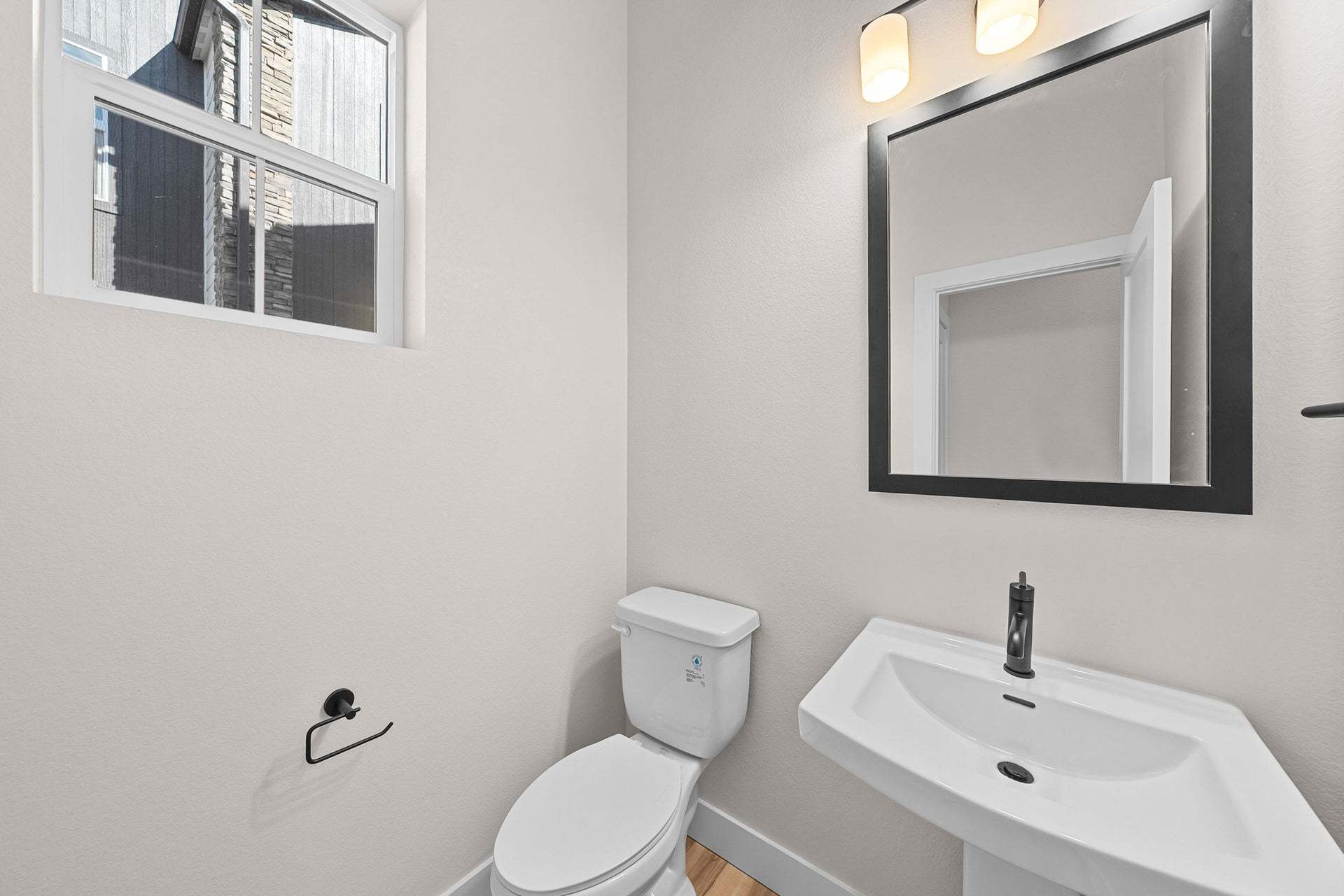 Duet at Sterling Ranch | Plan 1 | Powder Bath | Representative Photo