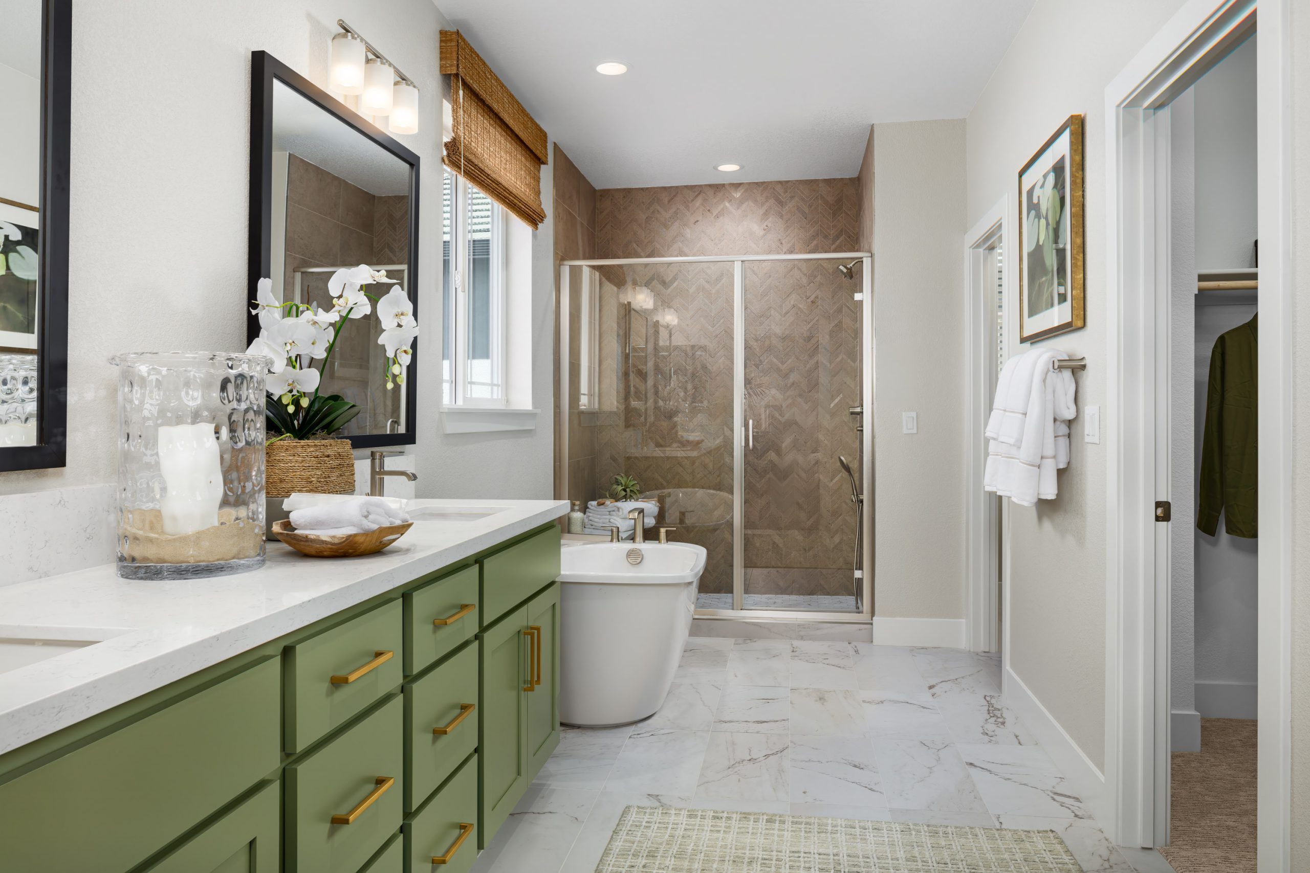 Primary Bathroom with Dual-Sink Vanity, Freestanding Tub, and Walk-in Closet