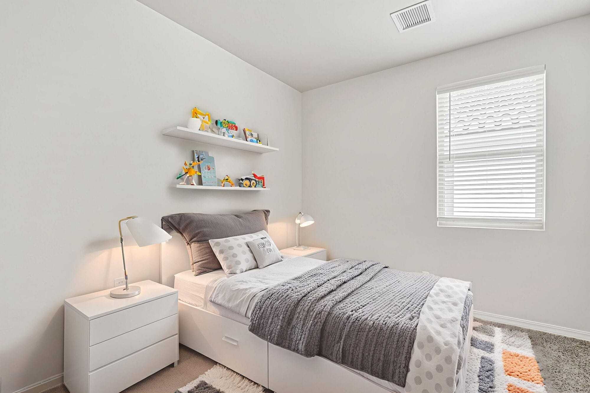 A beautifully staged bedroom inside the Desert Willow floorplan, designed to showcase comfort, functionality, and modern style.