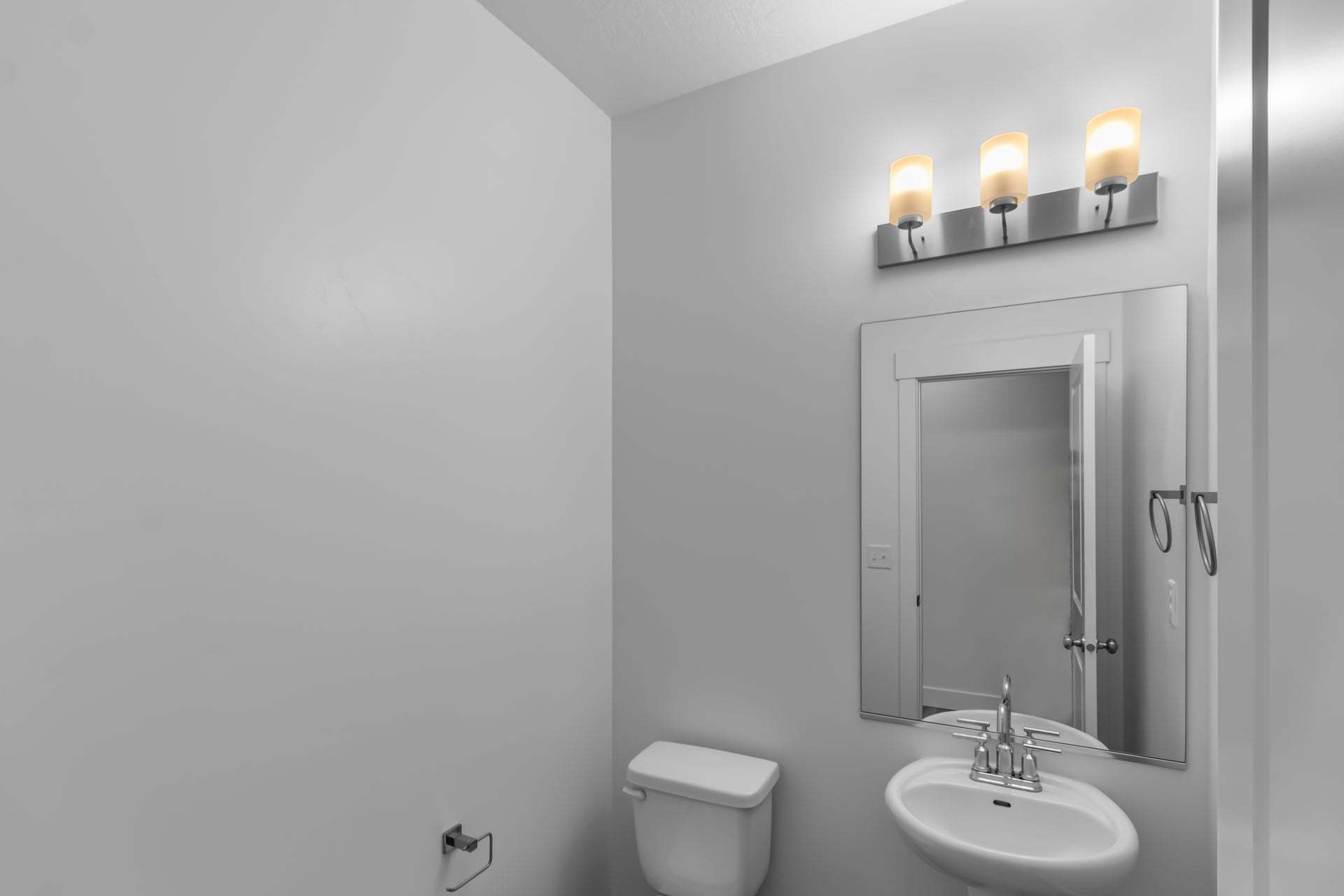 Half Bathroom, main level *Finished home photos are representational images only. See sales agent for details.