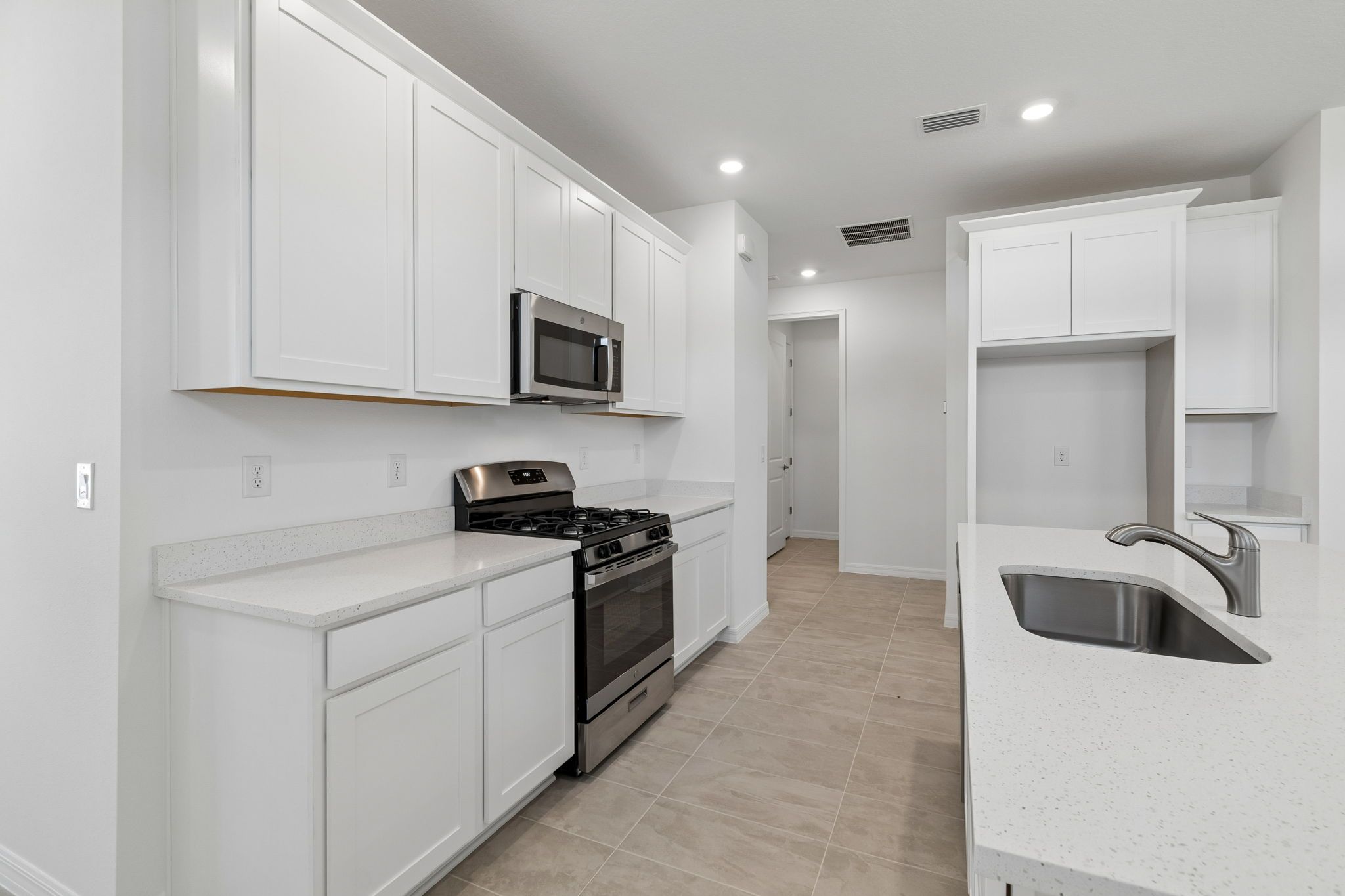 Sandpiper new construction luxury paired villa home plan kitchen 55+ in Sun City Center, FL at Fairway Pointe by William Ryan Homes Tampa