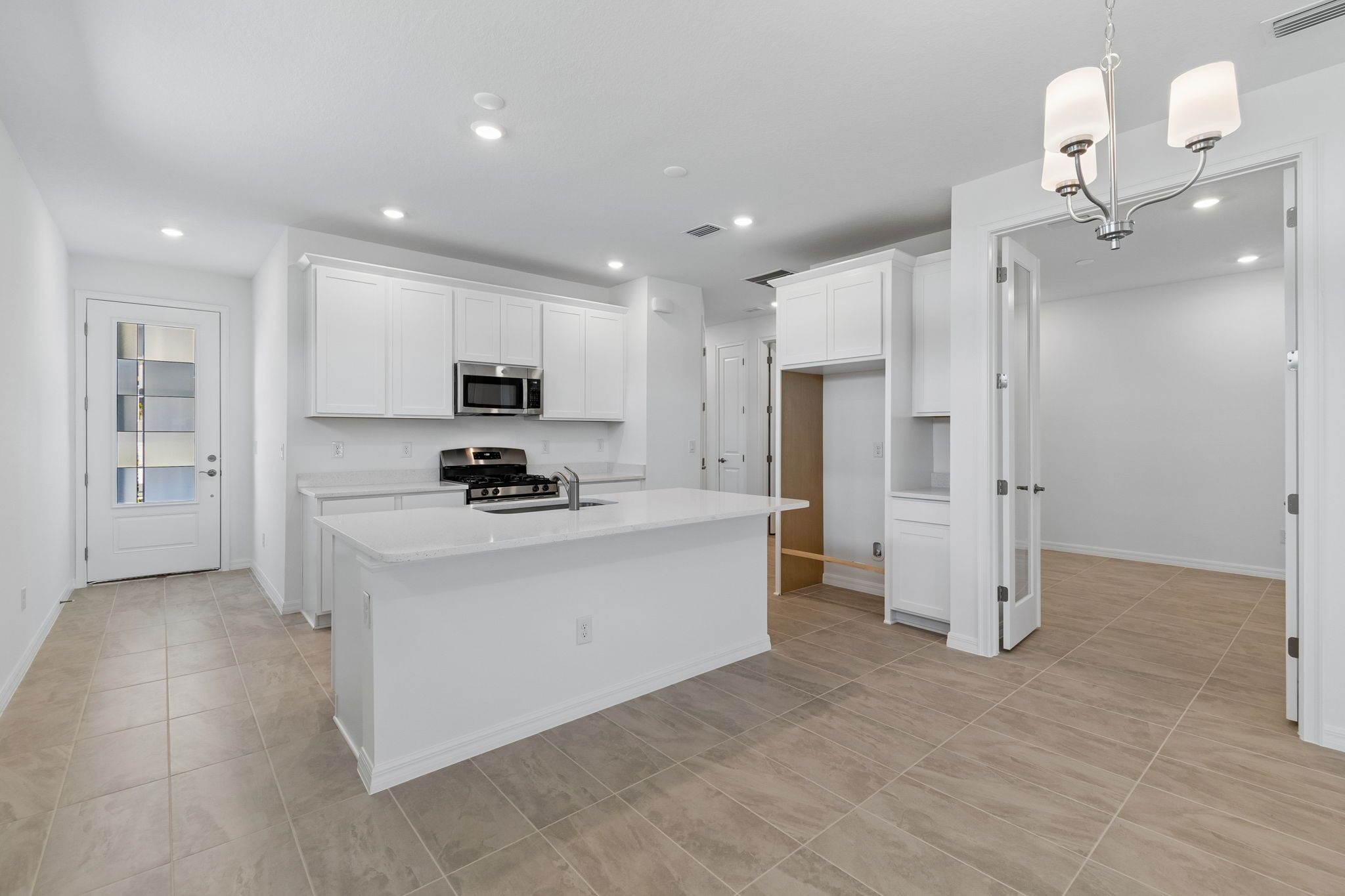 Sandpiper new construction luxury paired villa home plan kitchen 55+ in Sun City Center, FL at Fairway Pointe by William Ryan Homes Tampa