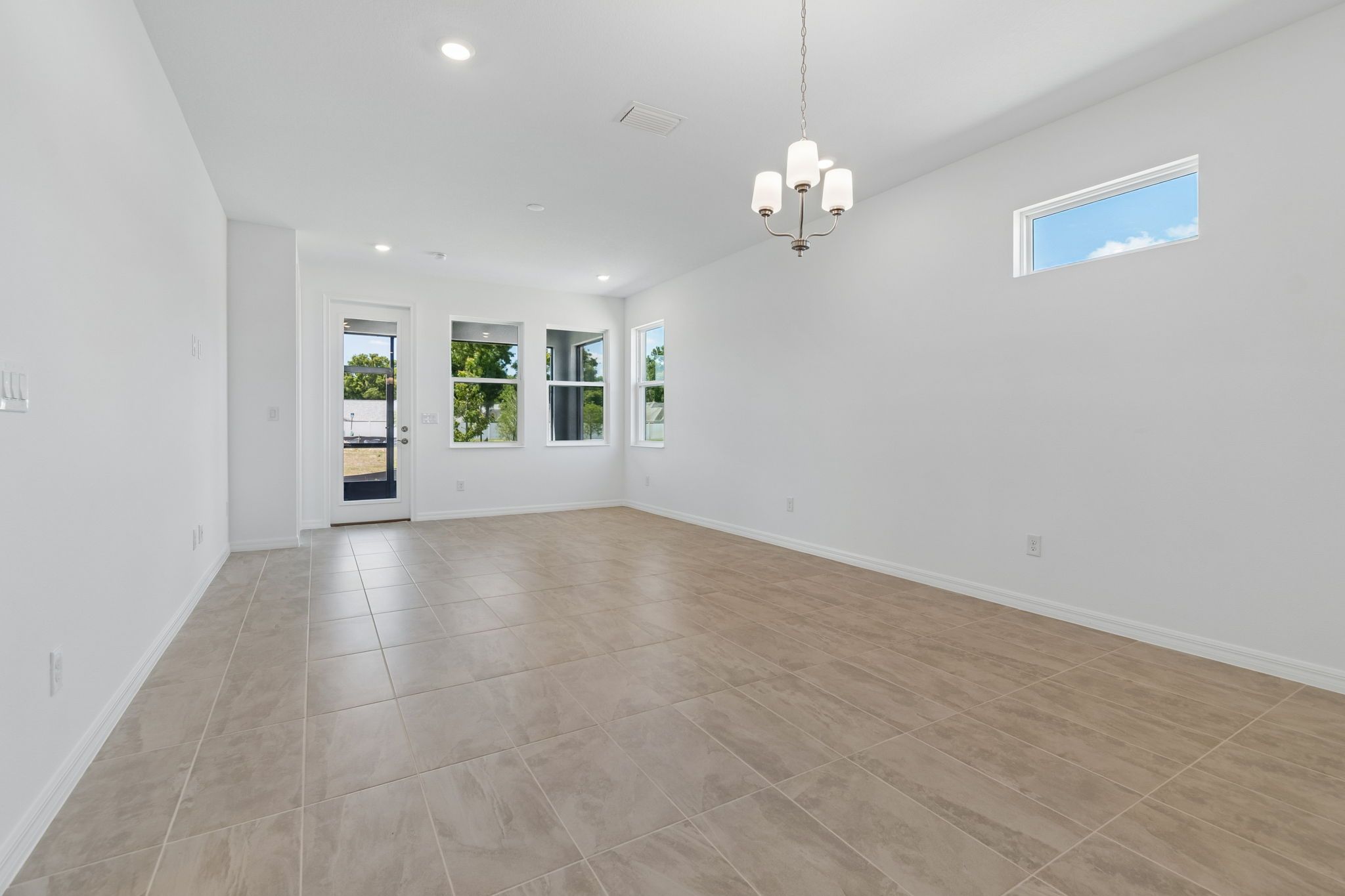 Sandpiper new construction luxury paired villa home plan living room 55+ in Sun City Center, FL at Fairway Pointe by William Ryan Homes Tampa