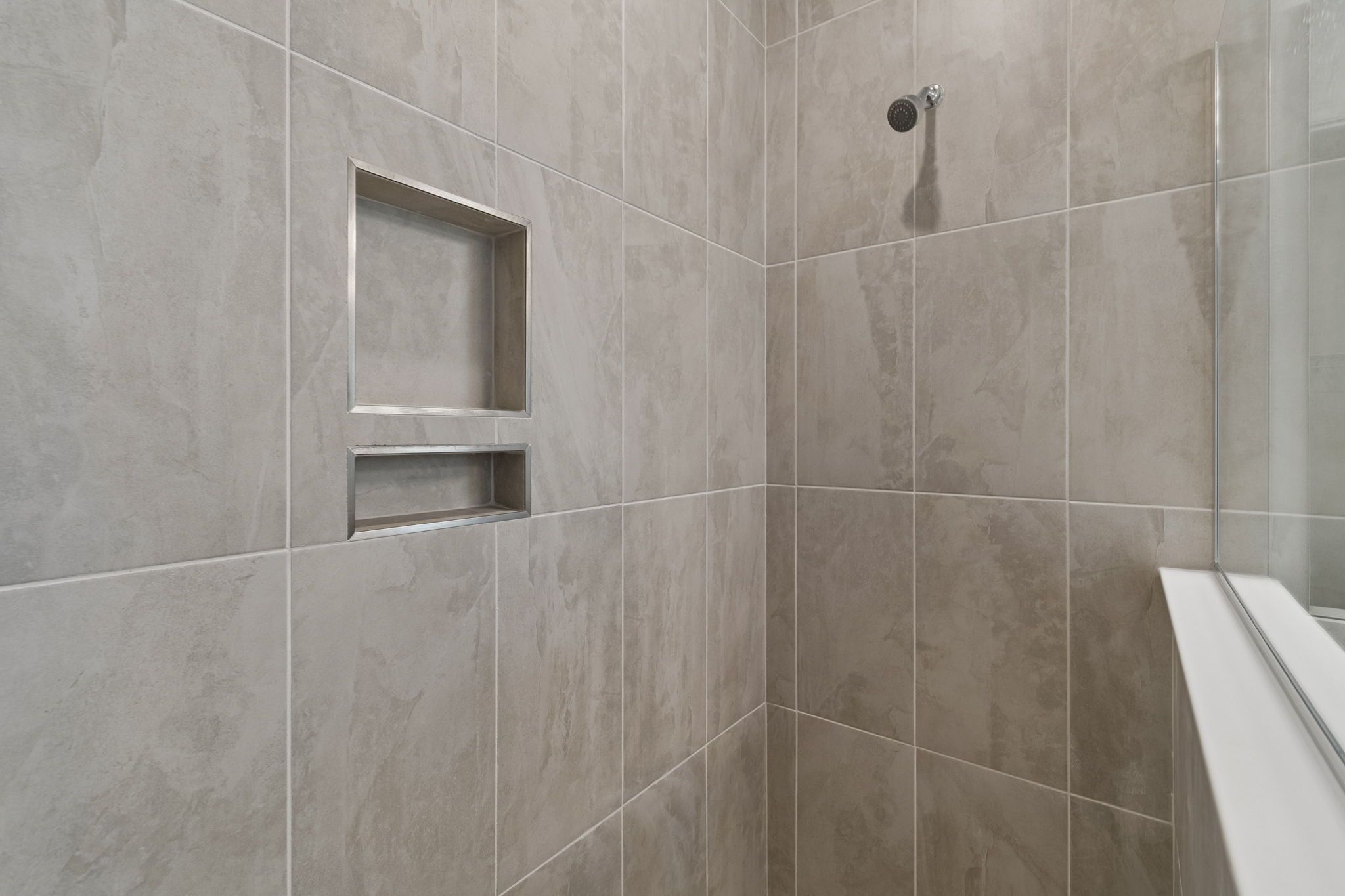 Sandpiper new construction luxury paired villa home plan primary shower 55+ in Sun City Center, FL at Fairway Pointe by William Ryan Homes Tampa