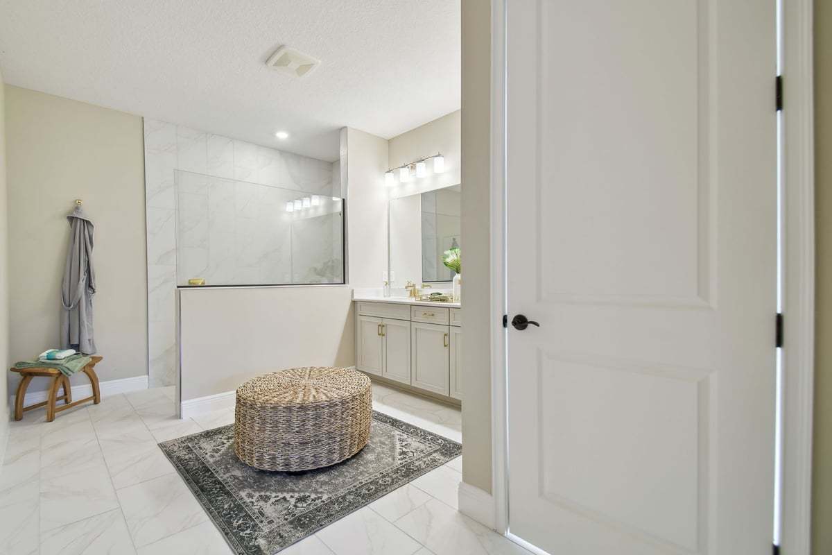 first floor master bathroom walk in shower and double vanity