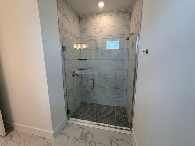Sweetwater primary bathroom glass tiled shower