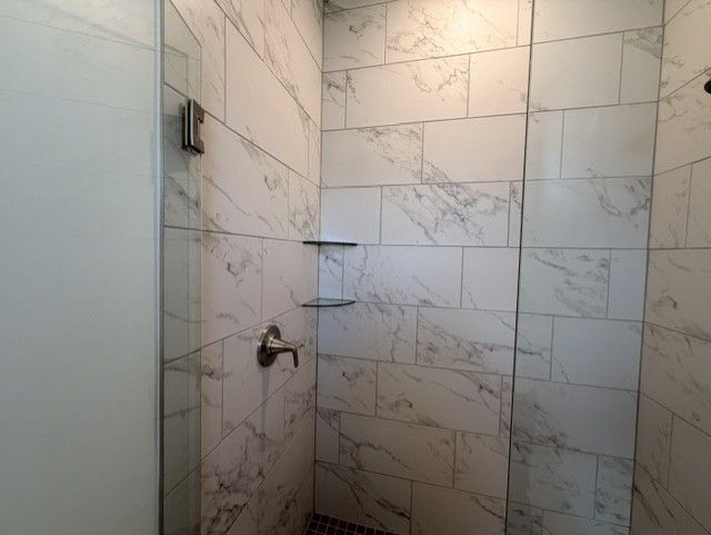 Sweetwater primary bathroom glass tiled shower