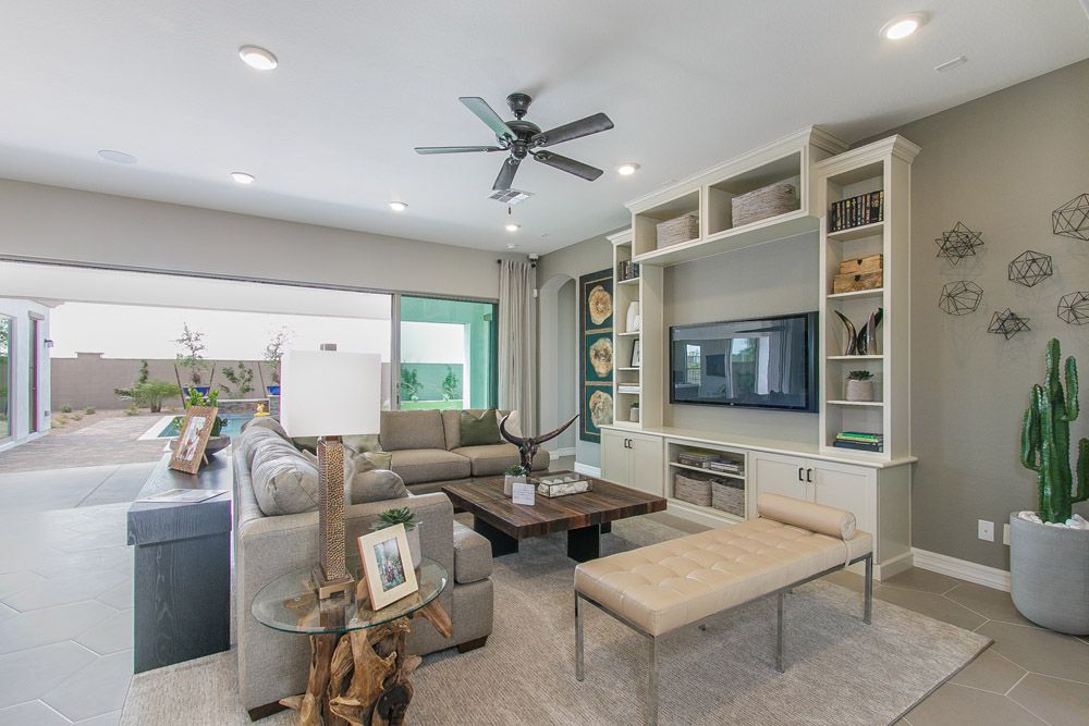 family room and open door to patio Carina model home Tranquility at Montecito in Estrella William Ryan Homes