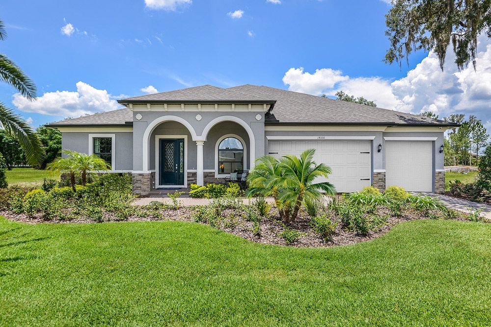 Joyce home french country with optional stone elevation front exterior view by William Ryan Homes Tampa