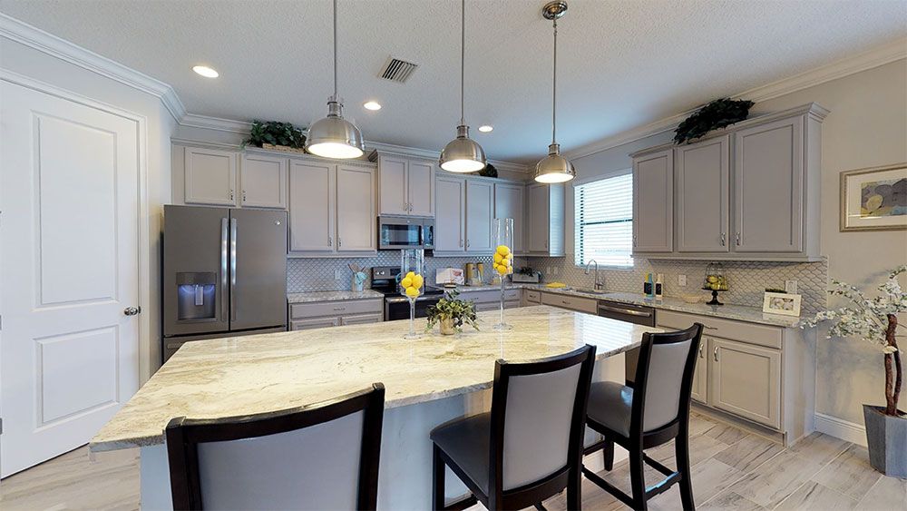 Juniper-FL Model Home - Beautiful Kitchen with Stainless Steel Appliances, Large Pantry, and Granit