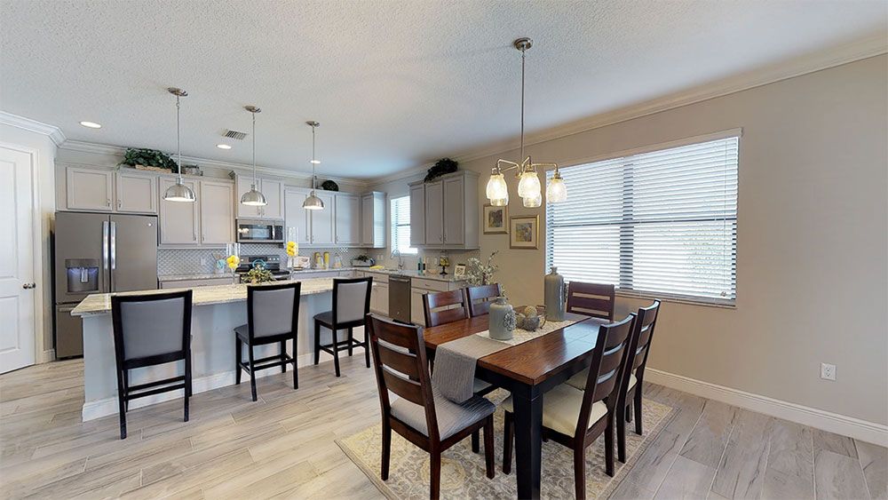 Juniper-FL Model Home - Kitchen has Island Seating plus Casual Dining Area