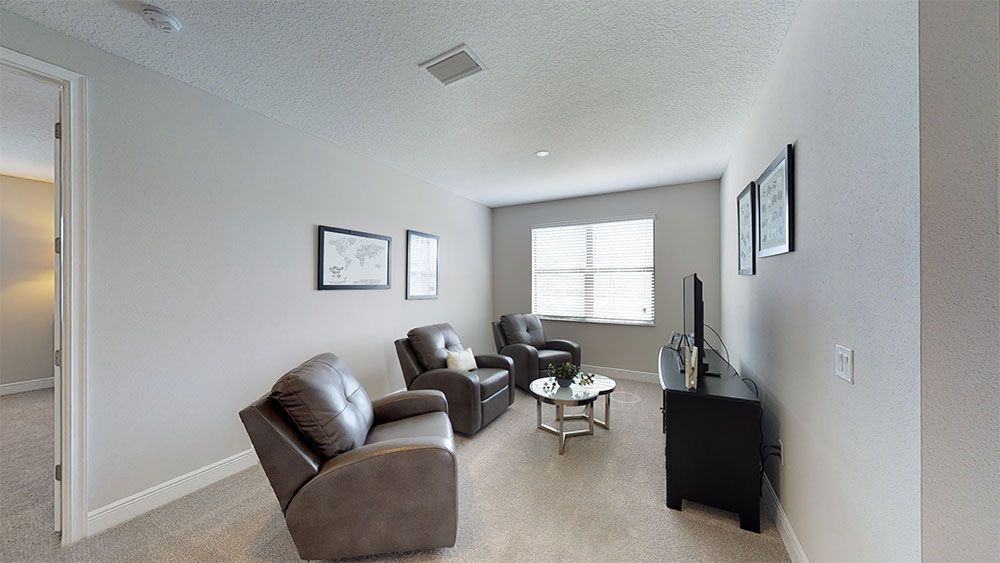 Juniper-FL Model Home - Second-Floor Spacious Loft Separates Bedrooms into a Split-Plan