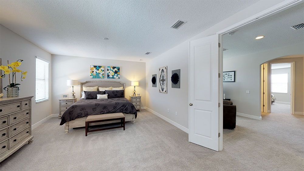 Juniper-FL Model Home - Master Bedroom Suite with Double-Door Entry from the Loft